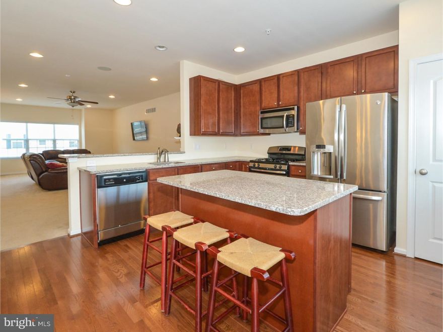 Spacious contemporary townhome with tons of parking, situated in the quiet, private, highly regarded neighborhood of West Conshohocken. Admire the upgraded double bay window in front of home on 2nd AND 3rd floors as you pull into your 2-car garage with driveway space for 2 more vehicles. Enter and head up to the open, straight-through living, dining, and kitchen space. Note the recessed lighting, oak hardwood flooring, gas fireplace, and convenient powder room. The immense kitchen boasts an oversized island, energy efficient stainless steel appliances, granite countertops, and full-height cabinetry. From here, step out onto your 20' x 10' composite deck where you can relax and enjoy the view. Back inside, head upstairs to check out the master suite featuring his and hers closet (one of them is walk-in), ceiling fan, and ensuite full bath with double vanity and shower with glass-enclosure. Plus, two more delightful bedrooms with ceiling fans, a lovely hallway bath, and convenient upper floor laundry. Make sure to check out the finished basement with access to the rear yard. Sliding glass doors lead out to your charming back yard. This home is over 22' wide and over 40' deep, and you'll enjoy 9'  ceilings throughout, ceiling fans, beautiful upgraded stair railings and ample storage under the stairs, in the attic, and in the mounted garage shelving. All of this, located in the Upper Merion School District and right by the ramp to I-76 for easy connection to I-476 and the Turnpike. Plus, you're steps from great restaurants, bars, Wawa, and other local businesses. Snatch this place up before it's too late!