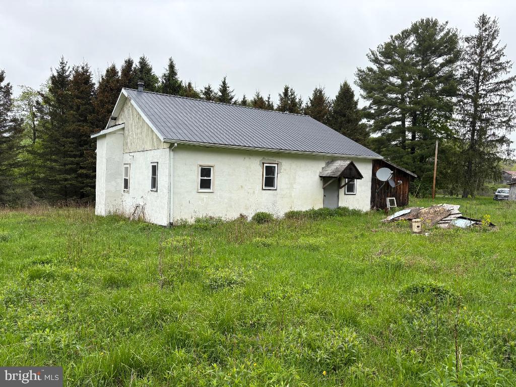 Located at 28 Erickson Road, Ulysses Township, Potter County PA. This 1.87 acre property is along the Potter County ATV / UTV system with 397 Miles of Township Roads, 22 Miles of PennDOT-Administered Roads Newly Open to ATV Use and 57 Miles of State Forest Roads and Trails (includes Susquehannock ATV Trail) for a total of 476 miles. The cinder block building with cement floor has potential to become a home or a camp. Electric is to the main building with 200 amp service, Drilled water well and out house with concrete sewage tank.