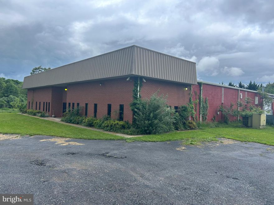 Warehouse located in the Burr Industrial Parl.  20,000 SF, 1 drive-in door, 4 dock doors, 3 acres with a fenced in yard.