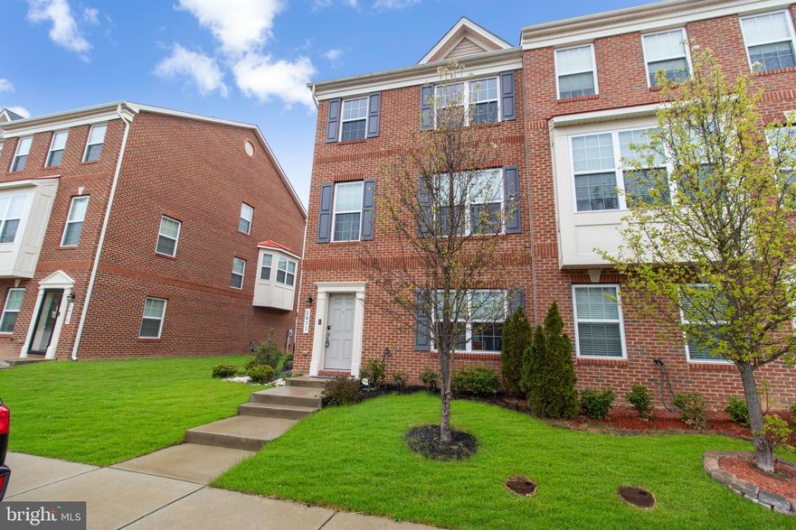 Looking for a townhouse with a first-floor bedroom and full bath?  Look no further! This end unit townhouse with 2-car garage is only 8 years old and has only had one owner. The second level has a gourmet kitchen with ample cabinet and counter space, an island, granite countertops, a full double-door pantry, built-in microwave and ample dining space. It adjoins the family room which has French doors leading to the deck. This level also features a powder room. The top level has 3 bedrooms, 2 full baths and don't forget the convenient upstairs laundry room. Relax in the owner's suite with vaulted ceilings,  corner soaking tub, separate shower and double vanity. Hardwood floors on first 2 levels and carpet on the top level. This contemporary home is just waiting for you! Sellers would prefer to use Capitol Title for settlement.