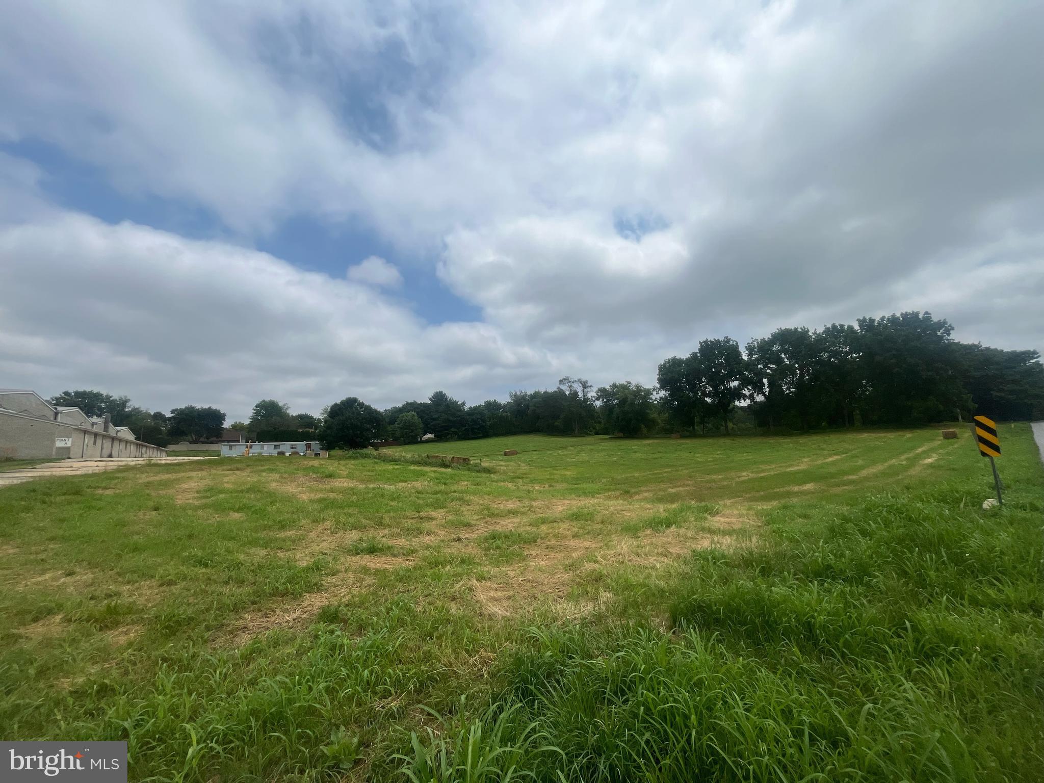 Excellent opportunity for investors or agricultural users - this 6.6-acre property in Kennett Township is located directly adjacent to Kennett Square Borough and features a versatile mix of existing improvements and long-term potential. The parcel includes four 68-foot double mushroom houses, a storage shed, and a 2-bedroom ranch-style home, offering immediate utility for farming or agricultural-related operations.
Zoned Specialized Agriculture (SA), zoning permits agriculture-related warehousing, indoor storage, or distribution facilities by right, and boarding kennels by special exception. The property is enrolled in Act 319, which may provide tax benefits.
With a neighboring parcel zoned Residential Medium to High Density (RMHD), rezoning may be possible, potentially allowing for single-family homes, twins, or retirement communities by right, and townhouses (up to 6 units/acre) or multifamily dwellings (up to 12 units/acre) by conditional use.
Additional adjacent acreage is available - see listings for 114, 115, and 117 Chandler Mill Road. Located in the award-winning Kennett Consolidated School District, just minutes from downtown Kennett Square, Longwood Gardens, and major routes.
Buyer to verify all zoning, subdivision, and rezoning requirements with Kennett Township.