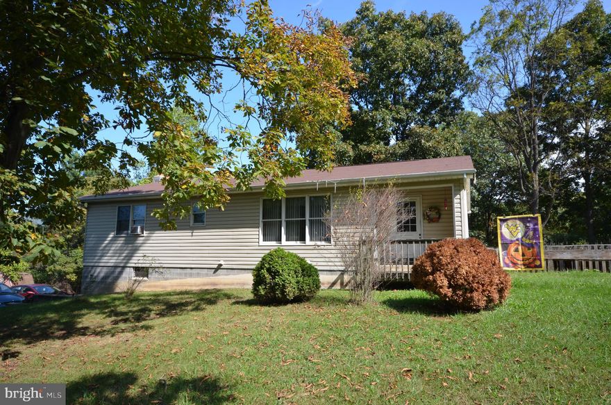 Stick built ranch home with 6" exterior framing and finished basement.  Enjoy the outdoors on this 2.4 acre property, or at the deeded access to the south branch of the Potomac River.  The main level has three spacious bedrooms and two full baths.  There is a third full bath in the finished lower level.  The lower level also has a spacious rec-room, wood stove and bar.    The heat pump was just replaced in 2024.  The roof was replaced in 2017 and the back porch was built in 2020.   Easy commuting distance to Cumberland, Romney or Winchester.  Hot tub included in sale.
