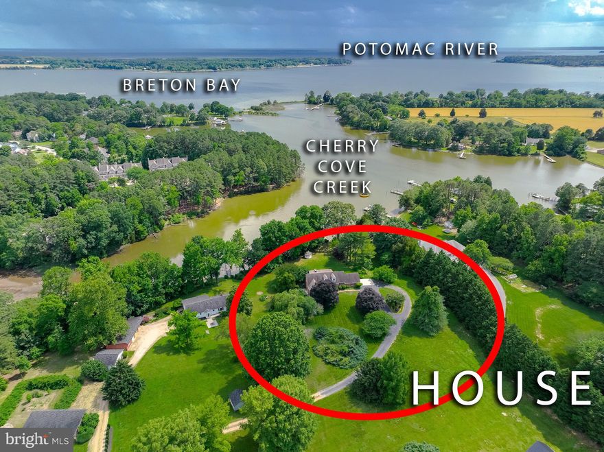 Ready for boating, fishing and crabbing?   Come home to this spacious brick cape cod on Cherry Cove with 222' of water frontage and  a 72' pier.   Sitting on just over 2 beautiful, private acres, this home features 4 bedrooms, 2.5 baths, along with a partially finished walkout basement.  Hardwood flooring throughout, granite counters and tile flooring in the kitchen,  Main level includes a formal dining room, living room and family room with a brick wood burning fireplace.  2 main level bedrooms and upstairs you’ll find another full bath and 2 bedrooms, one with its  own wood burning fireplace and built-ins.  New insulation throughout the attic    Oversized 2 car garage and a separate generator hookup.  "As Is" sale, however, this home is priced well under current in hand appraisal, which is available upon request.