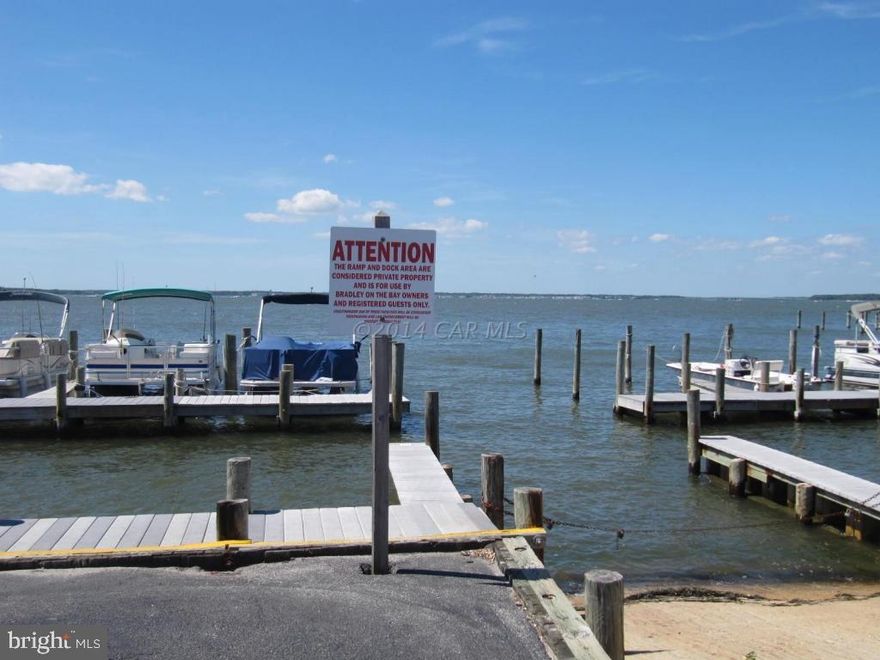 Fabulous starter unit priced to sell!  This is a wonderful midtown location with community boat slips, outdoor bayfront pool plus a boat ramp.  It does not get any better than this for the price!The unit itself sleeps 6 comfortably, has central heat and air conditioning, balcony with a view. Do not miss out on this buy! Big things come in small packages. One year warranty conveys to Buyers at time of settlement.