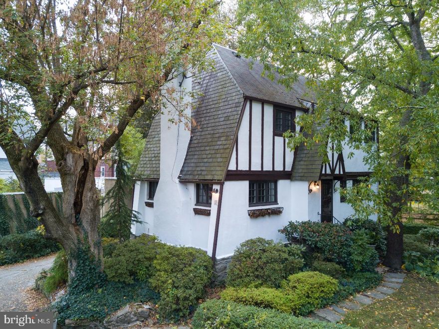 Welcome to 2 Balwyn Place, a unique community of English Tudor cottage homes originally built in 1928. Located in the Lower Merion School District only 15 min. from Center City Philadelphia. Right away you will notice the upgraded Pella architectural high efficiency windows and new coat of exterior paint on the home. Do not miss the private two car attached parking in the rear and beautifully maintained center courtyard. Enter through the front door to this quaint 3 BR, 1.5 BA home. To the left is the family room with a wood burning fire place and custom mantle. To the right is the dining room leading into the galley kitchen featuring shaker style cabinets, stainless steel appliances, and granite counter tops! Walk out the french doors to a private, professionally engineered deck with pergola and imagine yourself enjoying this space with a hot cup of coffee in the morning. The powder room is located on the main level and unfinished basement with laundry and exterior access is located through the kitchen. Taking the stairs to the upper level you will find 3 bedrooms and a full bathroom. Continuing up the second set of stairs to what other neighbors have made a 4th BR/Loft currently used as storage. This home has been meticulously maintained which is noted in the upgrade list attached and includes updated electrical, 200 amp circuit, installed central A/C, blown insulation throughout, parged basement walls, re pointed exterior stone, high efficiency hot water boiler, Amish designed and installed flag stone front door steps, R-19 batt insulation installed in attic joists, and new dishwasher and refrigerator. Schedule a tour today!
