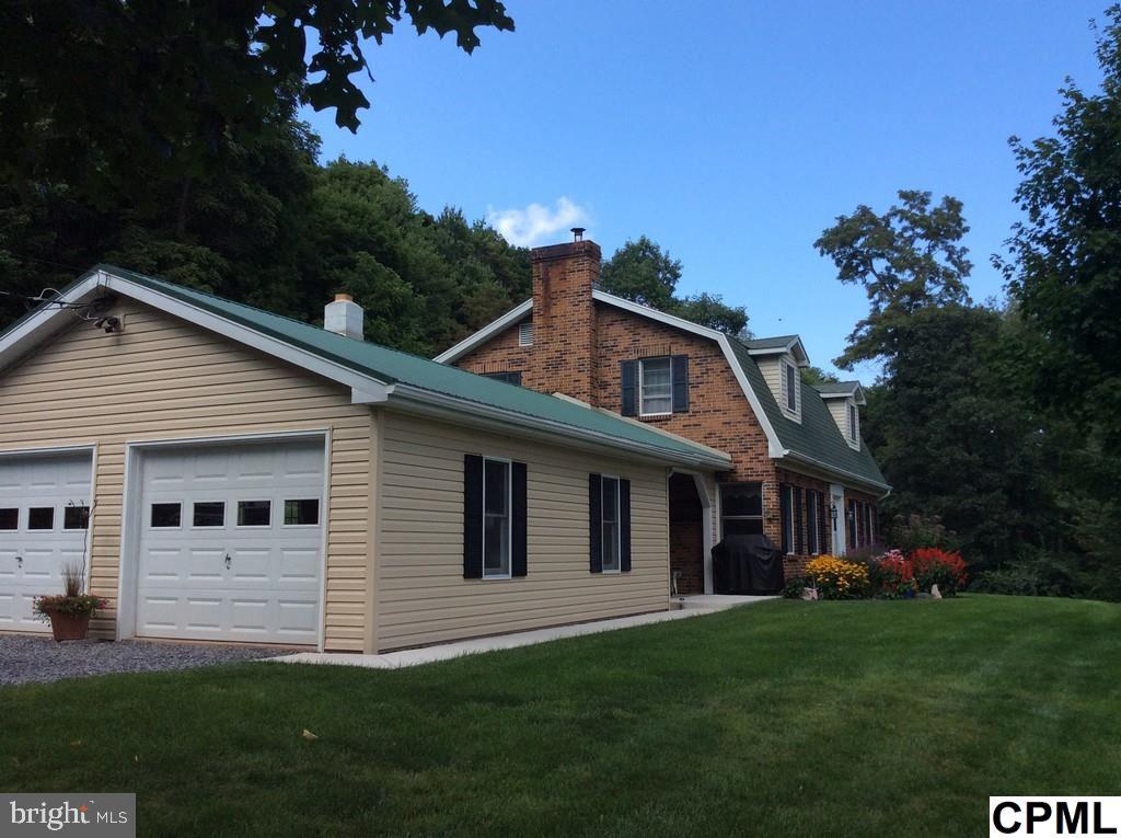 Two story Brick Cape Cod 2184sq' 17.6 acs 3beds 2.5 baths. Oil/wood heat. Two car attached garage.Newly remodled 500sq' kitchen with new stainless appliances.New hearthstone wood burner in kitchen fireplace.First floor laundry with half bath.200sq' mudroom between house and garage.Full semi finished basement with fireplace and full bath.300sq' deck off front overlooks 4ac field included in property.Lg two level block barn.VIEWS!