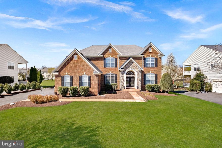 Experience unmatched luxury in the heart of Ashburn’s highly sought-after Belle Terra community! This exceptional east-facing estate offers over 6,800 finished square feet of refined living space and more than $500,000 invested in a truly resort-style backyard oasis.

Step outside and be captivated by your private retreat, featuring a custom NV Blu-built heated saltwater pool and spa, enhanced with stunning spillover and sheer descent water features, extensive hardscaping, and elegant retaining walls. Entertain year-round beneath the covered open-air pavilion, complete with a striking herringbone fireplace, or host unforgettable gatherings on the recently replaced oversized Trex deck—perfect for becoming the envy of the neighborhood.

Inside, the home continues to impress with 5 spacious bedrooms and 4.5 bathrooms upstairs, plus a main-level bedroom ideal for guests or multigenerational living. Enjoy the warmth and charm of four interior fireplaces, along with peace of mind from recent upgrades including HVAC, hot water heater, and roof.

The chef’s kitchen is designed to inspire, showcasing a 48-inch KitchenAid refrigerator/freezer, stainless steel appliances, an expansive island with a separate vegetable sink, and a beverage refrigerator—perfect for both daily living and entertaining.

The walk-out basement is truly an entertainer’s dream, offering direct pool access, a massive custom bar with ice maker, commercial-grade beer refrigerators, dishwasher, and sink. Additional highlights include a pool table/game area, a private gym or office space, and a stylishly updated full bathroom.

All of this is ideally located just minutes from the Silver Line Metro, approximately 7 miles to Dulles International Airport, and with easy access to the Dulles Greenway—making commuting effortless. Zoned for the top-rated Briar Woods High School pyramid, this home offers both luxury and convenience.

This is more than a home—it’s a lifestyle. Come claim your place as one of Belle Terra’s finest and most admired residences!