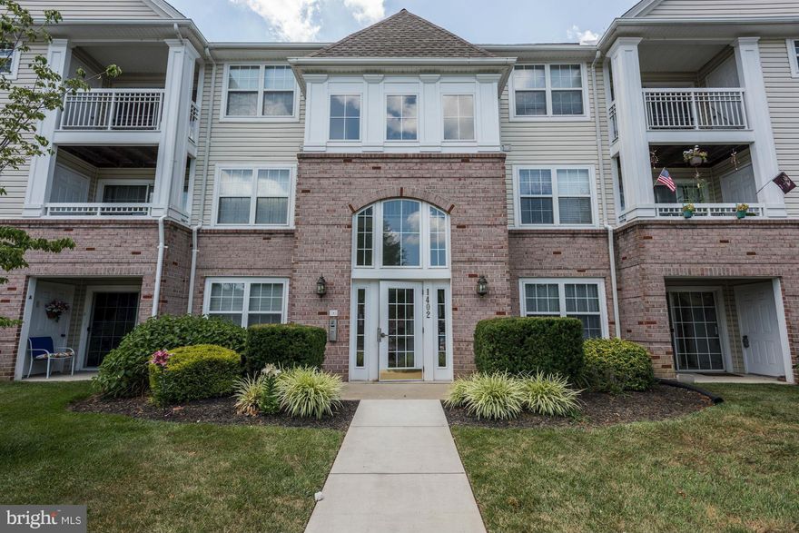 Walk into the first floor unit, on the rear side of the building. Plenty of people can stay in the unit, as it has both a main bedroom with a full bathroom in the suite, and there are also two bedrooms with their own bathroom on the other side of the unit. It is move in ready-- nothing to do but enjoy the fire after you move in.