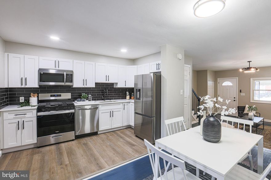 Welcome to 8158 Gray Haven Rd in Dundalk's Gray Haven community! This updated gem features 3 beds, 2 full baths, and a sleek kitchen with stainless steel appliances. The large rear addition, hardwood floors, luxury vinyl plank flooring, and quartz countertops elevate its charm. Picture gatherings in the stylish living space, complemented by a custom backsplash. The finished basement provides extra room, and the rear parking pad adds convenience. Your dream home awaits – seize the opportunity to make memories in this modern haven! #HomeSweetHome