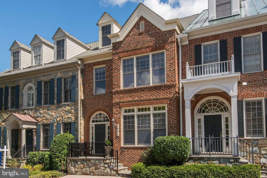 Beautiful town home in sought-after Evans Farm loaded w/ custom details & designer updates! Ideal floor plan w/10-foot ceilings, elevator, Chef's Kit w/family room & breakfast room opening to patio. Great Room w/handsome fireplace, built-ins & coffered ceiling. Large Master Suite + 3 BRs with hardwood flooring.  Large 4th level w/full bath.  LL Rec Rm w/ flex spaces. Location is private & quiet.