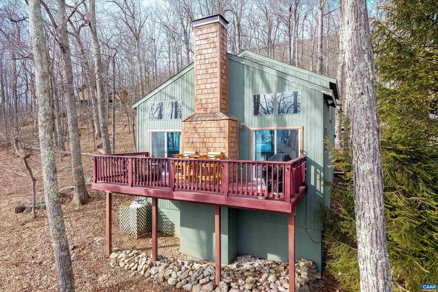 Move-in ready mountain cottage ideally located at the end of a quiet cul-de-sac in Wintergreen, offering privacy, seasonal mountain views, and walkable access to the slopes. This well-maintained home has seen extensive updates and is being sold turn-key ? ready for immediate enjoyment or continued rental use.  Recent improvements since 2023 include an encapsulated crawlspace, new hot tub with rebuilt platform, rebuilt exterior stairs, deck furniture, arcade game, and a fully stocked interior designed for short-term rental success. Multiple future rental reservations are already on the calendar, providing instant income potential.  Major updates include a new roof (2020), tankless water heater (2020), renovated kitchen and bathrooms (2020?2022), interior paint and new upstairs carpet (2020?2022), exterior paint (2021), paved driveway (2021), gas fireplace installation (2021), and complete chimney rebuild (2021).  Additional highlights include ample off-street parking, a fenced backyard for dogs, and a peaceful mountain setting that balances convenience with privacy. A rare opportunity for a true turn-key Wintergreen retreat. Don't miss this one!,Wood Cabinets,Fireplace in Living Room