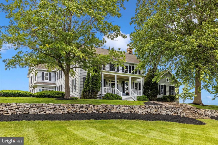 Highly motivated sellers! WELCOME HOME to the best of all worlds! Looking for something with country charm, feel, and space, but not far from shopping, restaurants, and  highway acess? Check! Looking for something with some land and privacy, but not isolated? Check! Nearly 2 acres with lots of *permanent* adjacent open green space in front and on both sides  - feels like 5 acres! Looking for community amenities like Olympic-sized pool, walking trails,  clubhouse, gym, dog park, and playgrounds, but not crowded in cookie-cutter homes? Check! LOW HOA fee of only $286 per QUARTER for all these amenities. This property is the homestead of the original Keller farm, most of which is now the gorgeous Kellerton subdivision, yet this home, and this one alone, has acreage, open space, & original details. A beautiful, solid, exceedingly well-built home with significant modern updates at nearly 5000 finished SF on the main two levels. The grounds also offer the best of all worlds:  This home includes a 3-car garage, ample extra parking (can easily fit 8-10 more), an *amazing* HUGE covered summer pavilion with built-in masonry grill, fans, and lighting for family reunions or barbecues, or just a good book and a breeze on a summer afternoon. Change out the screens for windows and this could be a 4-season multi-purpose retreat. Front porch with a wide, gently sloping front yard that goes down to the original stone springhouse. Stone stairs and retaining wall add character and great looks, a very majestic presence from Yellow springs Rd. Inside the home, you will find very large rooms everywhere, including a 29’ x 26’ 2-story beamed Family Room with highest quality wood floors, a huge wood-burning stone fireplace, built-in bar area with mini fridge, a gorgeous 3-sided window seat nook with mountain views, and two ceiling fans. This room can comfortably hold lots of furniture, the biggest screen TV possible, a pool or game table, and with room to spare. The kitchen includes a 3-sided windowed breakfast nook, granite counter tops, a spacious island, subzero fridge, lighted coffee station, and more. A unique multi-purpose room is off the kitchen and open to it, with a sink and counter space, for crafts, food prep, etc - and it has beautiful views. WAIT til you see the MBR! *HUGE!* Room-size closet, separate dressing area, and built-ins. New washer and dryer, plus a laundry chute, in the main level laundry room. A huge 23 x 20 addition was added in 2003 with soaring cathedral ceiling, 2 skylights, an entire wall of lighted built-ins, and floor to ceiling windows. There is a separate exterior entrance and separate HVAC system as well. This space is ideal for those working from home, with or without visiting clients. It could also be easily used as a stunning main level primary bedroom, or in-law/au pair suite. The adjacent parlor could likewise be an additional bedroom. The front foyer, living room, dining room, and original turned staircase harken back to 1900 when the original part of the house was built. Original wood floors and period-style interior window shutters in the LR and DR are cool details. The main front staircase, as well as the rear staircase from the family room, lead to 3 VERY spacious bedrooms. An 8’ by 14’ gallery overlooks the family room just outside the enormous primary bedroom. There is brand new luxe carpet & pad in all of the bedrooms. The basement is unfinished, with walk-up to the rear yard through Bilco doors. New large capacity water heater. Plenty of room for a workshop, and loads of dry storage space. Roof is about 9 years old. All air handlers & heat pumps have been replaced, with the oldest one being only about 9 years old. Most systems are new or newer. Large rear patio and retractible awning. On the other side of Yellow Springs Rd there will be a park. Home warranty included. QUESTIONS? Please call! Sellers are motivated.