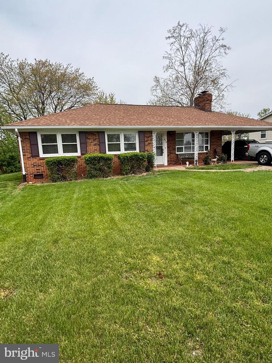 Lovely all-brick ranch home in established neighborhood close to dining, shopping and more, refurbished with luxury vinyl plank flooring, appliances and fresh paint, new roof and upgraded HVAC system. Huge hand-laid stone woodburning fireplace, spacious and level rear yard with large garden shed. Carport entrance for easy access to kitchen and large mud room.