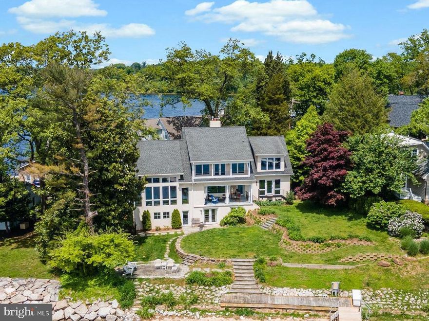 Welcome to 11 Cedar Point Road located within "LINSTEAD ON THE SEVERN",  waterfront at its best with amazing views of Round Bay & Severn River, deep water pier, sandy beach and a beautiful landscaped yard. This 5000 +square foot home has three levels with a large open two story space and walls of glass that creates the perfect serene location.  The lower level is fully finished to accommodate additional family members. It includes a  walk-out terrace overlooking Round Bay, a full kitchen, full bath and laundry room. Linstead on the Severn residents have access to three private  beaches, pavilion, playground, boat slips, pier and fun activities thought out the year.