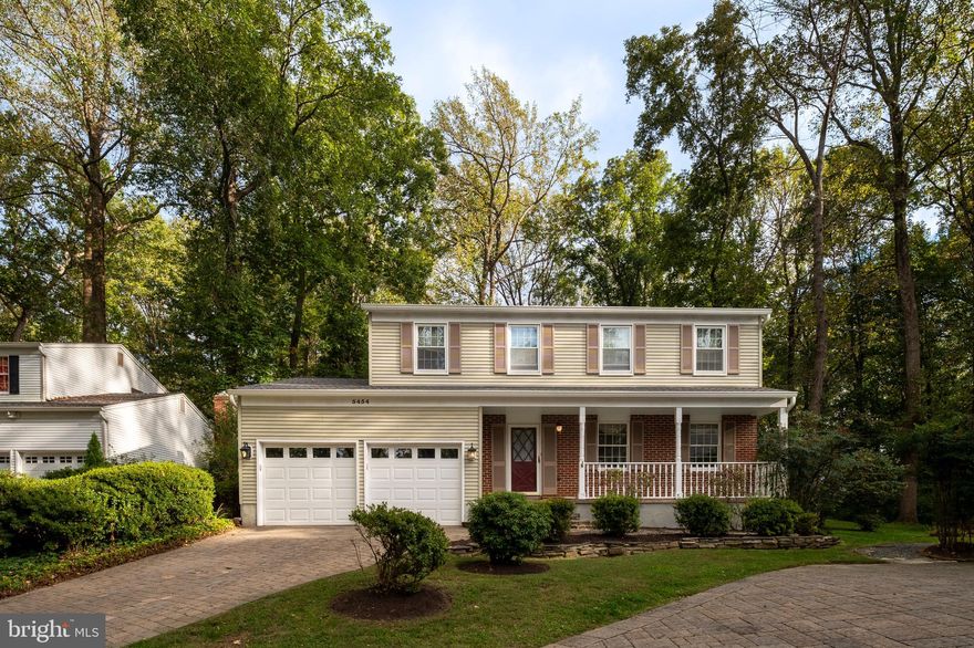 Welcome to 5454 Crowflock Court, a turn-key single family home located on a premium cul-de-sac lot with a large, level back yard surrounded by acres of protected woodlands!  This exceptional Ryland colonial has been well cared for by the original owners and features many recent updates.  A paver driveway and a covered front porch set the tone for this special home.  The kitchen features upgraded stainless steel appliances, granite countertops and a sunny breakfast area.  The adjoining family room offers a fireplace with a natural-gas insert, recessed lights and custom built-ins.  Relax in the spacious living room featuring new plush carpeting and entertain in the formal dining room with upgraded lighting.  Upstairs you will find four spacious bedrooms with brand new carpet and two upgraded full baths.  The primary bedroom offers a large walk-in closet, a separate vanity area and a private full bath with full marble shower.  The hall bath has been completely renovated with new flooring, a new tub/shower combo and a new double sink/vanity with quartz countertops.  Bonus - there is hardwood flooring under the carpet in all the bedrooms and don't miss the laundry chute!  The finished lower level offers a rec room with new carpet and recessed lighting, a laundry/storage room and a separate workshop.  Other great features include an EV charger in the two-car garage, a new water heater in 2025, some replacement windows and a new roof in 2023.  This home is located on one of the best lots in Thunder Hill.  Relax on the brick patio overlooking the tranquil back yard backing to acres of open space and towering trees.  Easy access to shopping, recreation and all the benefits of living in Columbia.
