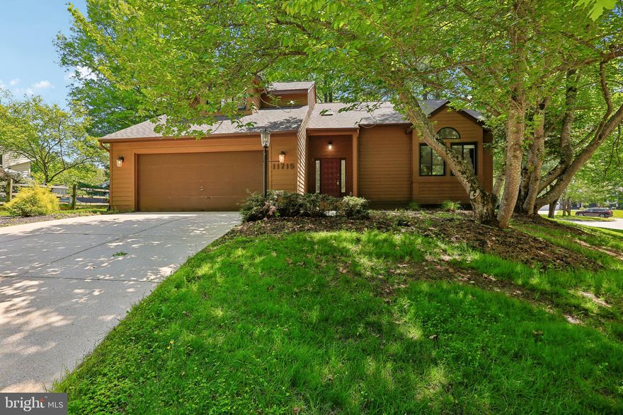Here is the ONE you have been waiting for!  A RARE opportunity to own a true Columbia contemporary, perfectly positioned on a private, WOODED QUARTER ACRE LOT and offering approximately 4,000 square feet living space.  The home has been gently lived-in and greatly cared-for by the ORIGINAL OWNER. Upon entering you’re welcomed by a bright foyer with skylight and gleaming HARDWOOD FLOORING that flow throughout the main level.  The heart of the home is the thoughtfully designed kitchen, featuring a convenient snack bar, built-in desk, tons of storage, and casual dining area; ideal for both everyday living and entertaining.  From there a door opens to the screened-in portion of the deck.  Just steps away, the warm and inviting family room with a WOOD BURNING FIREPLACE opens seamlessly to the rear deck, blending indoor comfort with outdoor living.  A formal dining room is ready for special gatherings, while the dramatic two-story living room with vaulted ceilings fills the space with natural light.  A main-level laundry room with direct garage access and a well-placed half bath add everyday convenience.  Upstairs, the expansive primary suite offers the retreat you’ve been looking for complete with vaulted ceiling, a massive walk-in closet, and a flexible adjoining space perfect for a home office, nursery, or sitting room.  The en-suite spa-inspired bath features dual vanities, a jetted soaking tub, skylight, vaulted ceiling, and a BEAUTIFULLY UPDATED walk-in shower with ceramic tile surround.  Two additional bedrooms share a bright hall bath with dual sinks and a skylight.  The lower level expands your living options with a fourth bedroom, full bath, spacious recreation room, and two abundant storage area.  Step outside and you’ll find the perfect setting for entertaining or unwinding; whether hosting summer gatherings on the EXPANSIVE DECK or enjoying quiet mornings, all surrounded by mature TREES FOR PRIVACY and a natural backdrop.  Updates you ask?  You bet!  The roof (approximately 10 years), HVAC & water heater (2018), and replacement windows; you can move in with confidence.  A solidly built home, perfectly priced for your personal cosmetic updates.  And then there’s the location… just minutes to everything.  Commuter routes, shopping, dining, and entertainment are all at your fingertips, including The Mall in Columbia, Town Center, and the vibrant Merriweather District.  Homes like this offering space, setting, and location don’t come along often. Come experience it for yourself and discover why 11715 Lightfall Court is truly a place to call home.  All information is deemed accurate but not guaranteed.