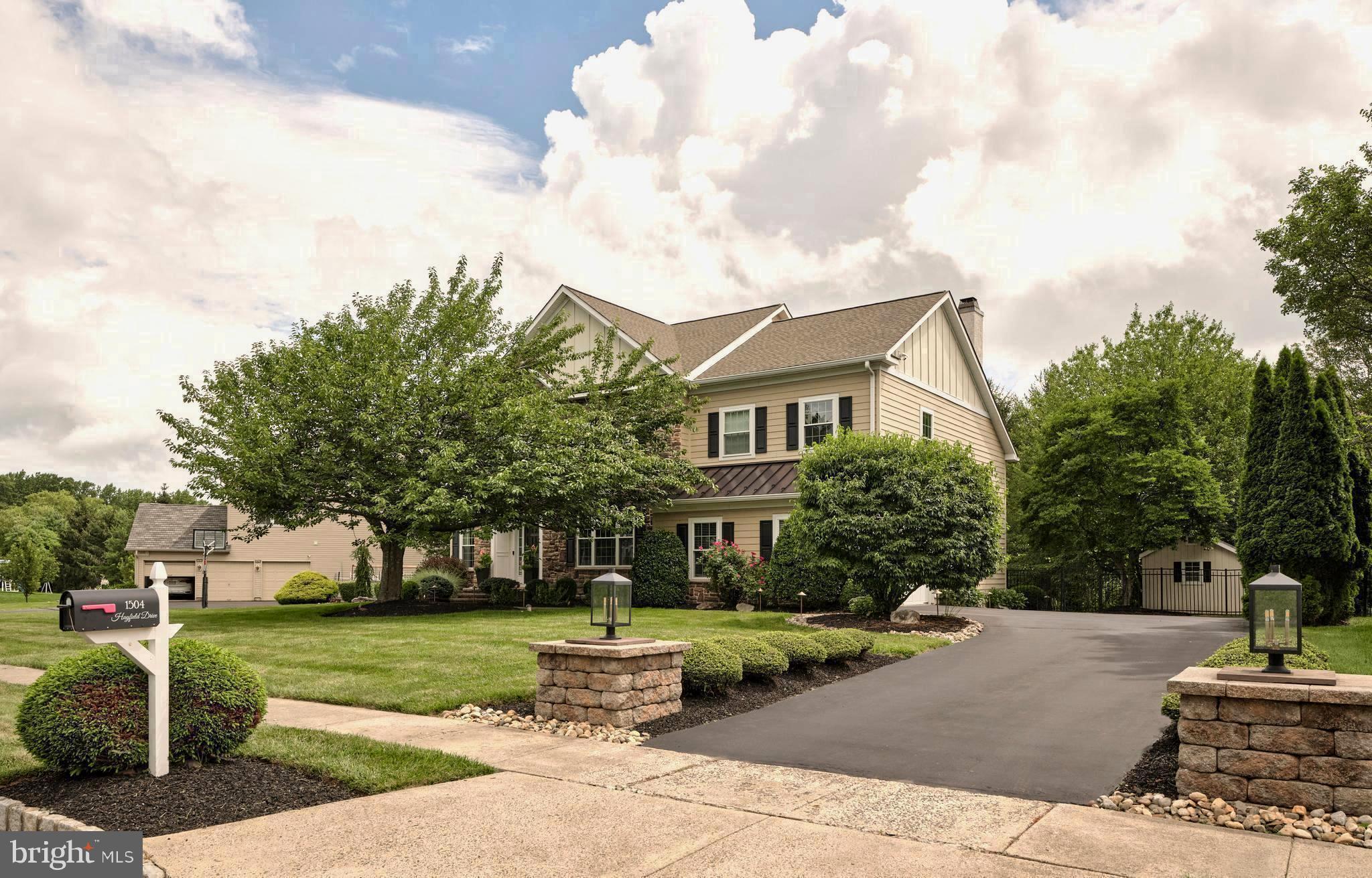 Welcome to 1504 Hayfield Drive—an extraordinary 4,900 sq ft Windsor Provincial model in the highly sought-after Clearview Estates neighborhood of Yardley. This fully upgraded 4-bedroom, 4-bathroom home
blends timeless elegance with modern luxury across three beautifully finished levels. Step inside to a dramatic foyer featuring an elegant formal staircase and a dedicated home office, flanked by a stylish living room with a custom molding accent wall. Entertain with ease in the adjacent formal dining room, which flows seamlessly into a fully renovated chef’s kitchen—custom-designed by Kitchens by Charles Weiler. Highlights include Medallion cabinetry, a sprawling quartz island with seating, a walk-in custom pantry, hidden appliance nook, and premium Miele and Thermador appliances. The sun-drenched kitchen dining area leads into a cozy windowed sunroom and overlooks the professionally landscaped backyard oasis. Enjoy a custom paver patio, stacked stone walls, turf and bluestone seating area—perfect for hosting or relaxing in style. The entire yard is fenced with double gates and includes a charming shed with dual entrances and windows. The great room features a gas fireplace with a custom mantle, a striking wall of windows with
motorized solar shades, and access to a second staircase. The main level also includes a designer laundry/mudroom with granite-topped cabinetry. Throughout the first and second floors, brand new wide-plank hardwood flooring has been installed, along with custom hardwood staircases featuring modern iron balusters and tailored carpet runners. Upstairs, the grand primary suite is a showstopper with a brand new, spa-inspired bathroom: a massive quartz-topped vanity, heated floors, smart glass privacy windows, high-tech Kohler toilet, and a luxe smart shower with bench seating. Three additional spacious bedrooms complete the upper level. Magnificent in purpose and size, the finished lower level offers versatile living space, including a full bath, convertible guest bedroom, gym area, egress, and ample storage. Additional premium features include: Whole house generator, Full property security system with exterior cameras, Built-in indoor/outdoor audio system, Fully fenced yard with lush landscaping. For exercise enthusiasts, Makefield Highland Golf Course is steps away and the renowned canal toe-path, less then two-tenths a mile away, is fully accessible via a safety path and for nature enthusiasts, Tyler State Park is less than five miles. Clearview Estates is within minutes is charming Yardley, Newtown and New Hope Borough's - home to riverside dining & theatre, and convenient commuter routes offering easy access Philadelphia, Princeton and NYC. This exceptional one-of-a kind residence is move-in ready and truly turnkey!