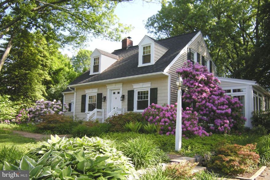 Charming cape cod home boasting a long list of tasteful updates and character.  First floor family room with skylights and fireplace.  Crown molding, recessed lighting and built ins throughout.  Hardwood floors. Living room fireplace. Four season room. Zoned central air. Stylish baths and walk in shower and skylight.  Updated windows, roof, spouting, siding, garage door, etc.  Peaceful deck with views of a beautiful private yard backing to fields