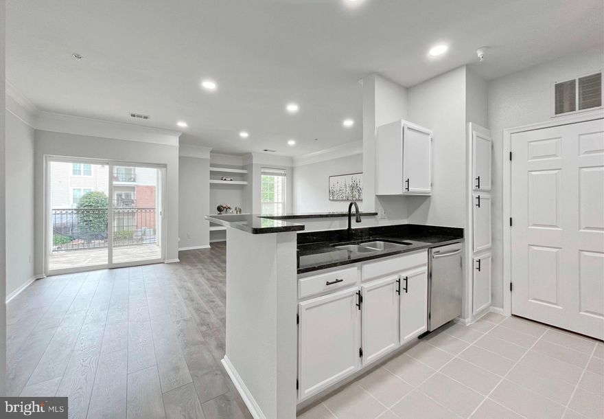 Welcome to 1600 Spring Gate Dr #2211! This beautifully appointed condo offers a rare opportunity to live in one of McLean’s most desirable gated communities, just moments from the Silver Line Metro and the vibrant hub of Tysons. Step inside to a bright, inviting living space designed for both relaxing and entertaining. This bright, sun filled home features a modern open concept layout where the kitchen flows seamlessly into the spacious living room and extends to a balcony, creating a perfect blend of comfort and indoor-outdoor living. A conveniently located in unit washer and dryer sits just off the kitchen for added ease. Luxury vinyl flooring throughout adds a clean, modern touch. The generously sized bedroom is filled with natural light and features a large walk-in closet, complemented by a full-size bathroom for added comfort and functionality. Recent updates include fresh paint throughout, recessed lighting, freshly painted cabinets, updated cabinet hardware, the dryer was replaced in 2025, a new HVAC system(both the furnace and condenser) was installed in 2025, and a water heater replaced in 2019, offering a stylish and move in ready space. Located in the Golden Triangle of Tysons, you are steps from the McLean Metro, Wegmans, Capital One Hall, and some of the finest dining and nightlife in Northern Virginia. You may check out EV charging station in front of the club house. Resort style amenities include an outdoor pool, fitness center, basketball court, and scenic walking paths. With immediate access to I 495, I 66, and the Dulles Toll Road, this exceptional unit delivers sophisticated and convenient living in one of Northern Virginia’s most sought-after locations.