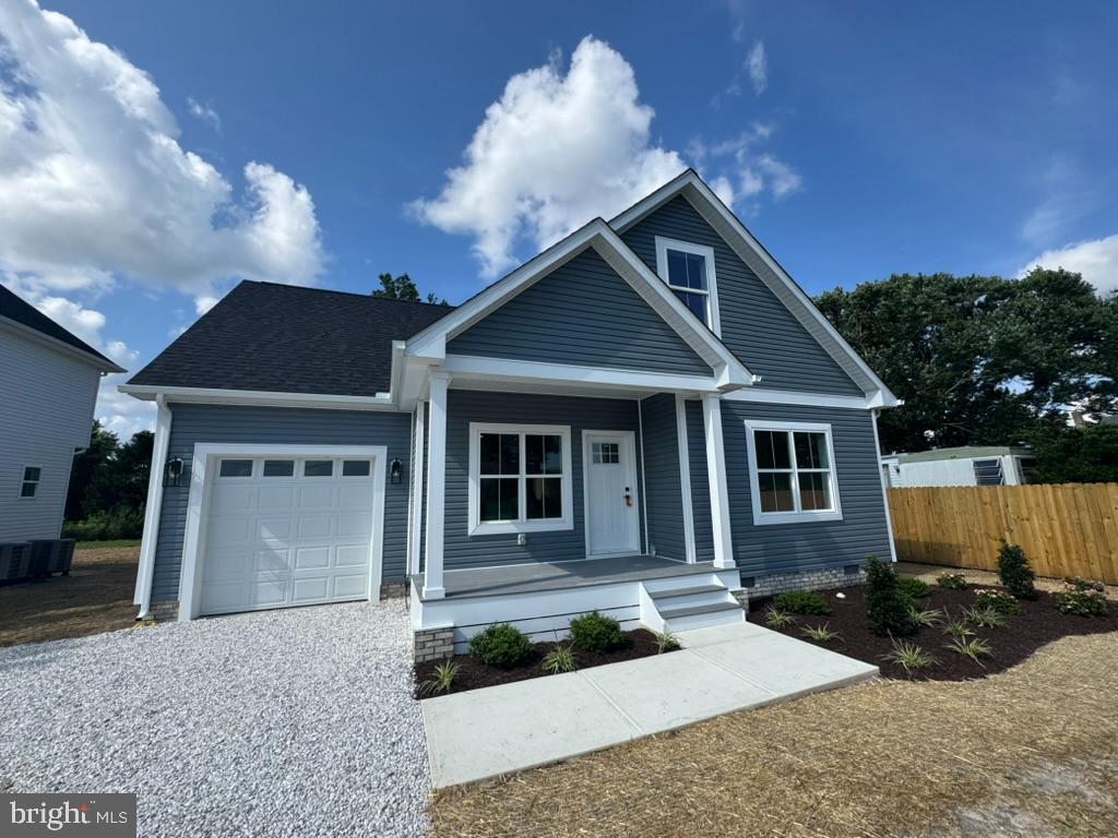 Welcome to this beautifully crafted 3-bedroom, 2.5-bathroom home in the heart of Pittsville, MD! This home features an open-concept layout with a spacious living room that flows into a modern kitchen complete with Fabuwood cabinets, soft-close drawers, quartz countertops, and stainless steel appliances. The first-floor primary suite offers a walk-in closet, dual vanity sinks, and a walk-in shower for your comfort. Upstairs, you'll find two additional bedrooms, a full bath, and a convenient laundry room. Enjoy the outdoors from the charming covered front porch. Thoughtfully upgraded throughout, this home includes Certainteed siding, IKO Cambridge shingles (Manufacturer Lifetime LTD in Dual Black), MI V3000 Series windows, an insulated garage door, upgraded outdoor lighting and landscape bed packages, and premium driveway stone. Interior upgrades include Craftsman-style trim and doors, Ledo door handles, durable LVP flooring with a lifetime warranty, and custom wood shelving in closets and pantry. With a 1-car attached garage and stylish finishes, this home is move-in ready and built to impress!