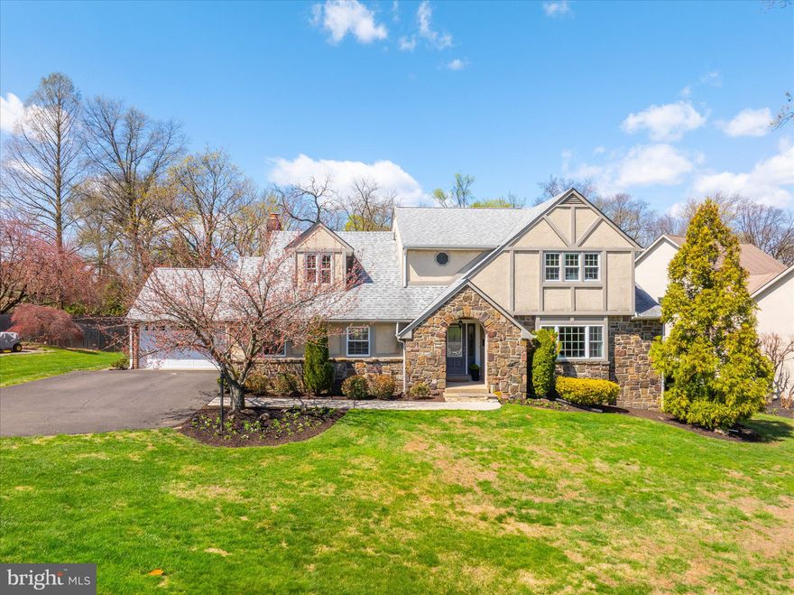 Are you searching for a home that blends timeless charm with modern luxury? This stunning Jenkintown Tudor offers the perfect combination of classic character and contemporary updates. Completely remodeled in 2014, this elegant stone and stucco home is truly move-in ready. The gourmet kitchen is a chef’s dream, featuring Viking appliances, 42" maple cabinetry, granite countertops, a tumbled marble backsplash, under-cabinet and recessed lighting, a breakfast bar, and a spacious pantry. Entertain with ease in the formal living and dining rooms or relax in the inviting breakfast room with a charming brick fireplace.  The expansive family room boasts a vaulted ceiling and French doors that open to a newer patio, seamlessly connecting indoor and outdoor living. A grand two-story foyer with a turned staircase welcomes you, while hardwood floors flow throughout the main level. Upstairs, the luxurious primary suite offers two walk-in closets, a dressing area, and a spa-like bath complete with a double granite vanity, heated tile floors, and a multi-head tile shower. Three additional bedrooms provide plenty of space, including a first-floor bedroom with a private bath perfect for guests or an in-law suite. A convenient first-floor laundry room adds to the home’s functionality.  Additional highlights include a spacious two-car garage, a beautifully landscaped half-acre lot, new windows and doors, upgraded 200-amp electrical service, multi-zone hot water heat and central air conditioning. Enjoy the great outdoors from your private patio with views of the expansive yard and access from both the family and dining rooms.  The location is incredible within walking distance of restaurants, entertaining, shopping and the train to Philly and a short drive to Trader Joes, Whole Foods, Abington Hospital and major highways! This home truly offers the feel of new construction in a highly desirable location. Opportunities like this don’t come often—schedule your showing today before it’s gone!