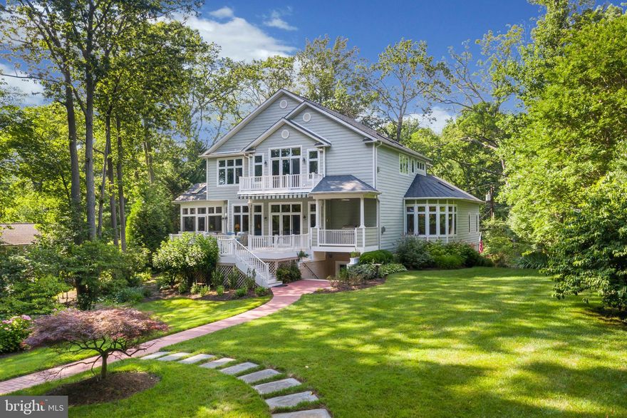 Looking for waterfront privacy, deep water, a beautifully landscaped lot & room for the extended family? Come preview this private,  waterfront setting. Custom built 6500 sq. ft. home located on over an acre lot with  boat house & protected pier that can accommodate up to a 50ft boat, plus a 10,000 lb. lift  and a floating small boat/ jet ski launch pad.  This residence includes an open floor plan, 10ft ceilings,  natural light, gourmet kitchen w/ granite & SS appliances, 1st floor bedroom suite, screened porch, stunning wine cellar, gorgeous hardwood floors, moldings, extensive built-ins, brick patio w/ fire pit, heated garage, and public water / sewer.  It offers four bedrooms, each with its own large private bath. The kitchen provides every luxury including a 6-burner gas cooktop, oversized refrigerator, two dishwashers and a walk in custom pantry.  The upper level primary bedroom features water views, vaulted ceilings, floor to ceiling windows, and offers 2 sitting areas, a gas fireplace, a wet bar, a large walk-in closet, and gorgeous bath with marble, granite, a deep whirlpool tub, two sinks with spacious counters, separate his and hers commodes complete with a large enclosed steam shower. Spacious lower level entertaining area , includes an oversized lounging space for watching movies and sporting events, a large screened television with impressive stereo and surround sound systems, and an additional kitchenette to help you entertain in style.  Beautiful custom lighting and irrigation throughout the property. BONUS! There is a boathouse with speakers and wifi, a  brick patio & hardscape slate fire pit that overlooks the deep water pier. GENERAC whole-house generator & room for an inground pool. This property is located in the sought-after community of Cape St John with excellent access to both Baltimore and Washington and only minutes from downtown Annapolis. Truly one of a kind and competitively priced.