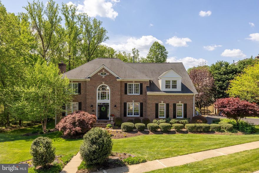 Welcome to 1257 New Bedford Lane, just 8 miles from Dulles International Airport, it’s a gracious, fully renovated home with six-full sized bedrooms, 5 full size bath and 2 half bathrooms, all with wooden floors throughout. It’s tucked at the end of a quiet cul-de-sac surrounded by mature trees and natural beauty. 
 
   •   From the moment you arrive, this home feels special. The classic brick façade, private wooded backdrop, and abundant natural light create a perfect blend of elegance and warmth.

   •   MAIN LEVEL:
Step inside a two-story foyer that opens to a beautifully proportioned elegant living room with gas fireplace and a dining room, ideal for both large and small gatherings. 
The heart of the home is the sun-filled family room where vaulted ceilings, and large windows provide all day sunlight.  An open stone fireplace invites you to relax with a cozy wood burning fire
during the winter months. French doors open to a spacious deck overlooking the  backyard, an ideal spot for morning coffee or entertaining with wood burning chimney for cooler evenings.
A spacious private office with bay windows overlooking the wooded area and large powder room complete the main level with the kitchen.

   •   KITCHEN:
The kitchen is designed for both style and function with granite countertops. Viking appliances, Sub Zero Fridges & Freezer, custom cabinetry, instant hot water & water filter, sensor faucet and a
cheerful breakfast area framed by large walk out glass doors that lead to the south facing deck. The kitchen leads to a convenient laundry room & closet and a custom 2 car garage.

   •   UPPER LEVEL:
Upstairs, the primary suite feels like a private retreat with a sitting area, his and hers dressing rooms, a spa-inspired marble bath, separate toilets, large shower and generous closet and storage space.
Three additional full bedrooms with storage closets, and two baths (one is  Jack & Jill) ensure access for all bedrooms & plenty of room for family and guests.

   •   LOWER LEVEL:
The walk-out lower level provides wonderful flexibility with two large primary bedrooms,  a large recreation room with gas fireplace, a fitness area with a half bath, a cedar wine cellar and two full
sized storage areas. It is the perfect setting for game nights, movie marathons, chill weekends or hosting out-of-town visitors.

   •   OUTDOORS:
Enjoy outdoor living from the upper deck or the covered patio below, surrounded by mature trees and peaceful views. Located just 2 miles from Reston Town Center with a host of good
restaurants, Wiehle & Reston Metros, several lakes with scenic running & walking trails, 18 outdoor pools & 48 Tennis courts.

   •   This home offers the best of both tranquility and convenience in one of Reston’s most desirable and sought after neighborhoods.