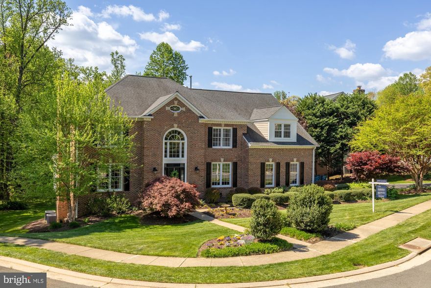 Welcome to 1257 New Bedford Lane, just 8 miles from Dulles International Airport, it’s a gracious, fully renovated home with six-full sized bedrooms, 5 full size bath and 2 half bathrooms, all with wooden floors throughout. It’s tucked at the end of a quiet cul-de-sac surrounded by mature trees and natural beauty. 
 
   •   From the moment you arrive, this home feels special. The classic brick façade, private wooded backdrop, and abundant natural light create a perfect blend of elegance and warmth.

   •   MAIN LEVEL:
Step inside a two-story foyer that opens to a beautifully proportioned elegant living room with gas fireplace and a dining room, ideal for both large and small gatherings. 
The heart of the home is the sun-filled family room where vaulted ceilings, and large windows provide all day sunlight.  An open stone fireplace invites you to relax with a cozy wood burning fire
during the winter months. French doors open to a spacious deck overlooking the  backyard, an ideal spot for morning coffee or entertaining with wood burning chimney for cooler evenings.
A spacious private office with bay windows overlooking the wooded area and large powder room complete the main level with the kitchen.

   •   KITCHEN:
The kitchen is designed for both style and function with granite countertops. Viking appliances, Sub Zero Fridges & Freezer, custom cabinetry, instant hot water & water filter, sensor faucet and a
cheerful breakfast area framed by large walk out glass doors that lead to the south facing deck. The kitchen leads to a convenient laundry room & closet and a custom 2 car garage.

   •   UPPER LEVEL:
Upstairs, the primary suite feels like a private retreat with a sitting area, his and hers dressing rooms, a spa-inspired marble bath, separate toilets, large shower and generous closet and storage space.
Three additional full bedrooms with storage closets, and two baths (one is  Jack & Jill) ensure access for all bedrooms & plenty of room for family and guests.

   •   LOWER LEVEL:
The walk-out lower level provides wonderful flexibility with two large primary bedrooms,  a large recreation room with gas fireplace, a fitness area with a half bath, a cedar wine cellar and two full
sized storage areas. It is the perfect setting for game nights, movie marathons, chill weekends or hosting out-of-town visitors.

   •   OUTDOORS:
Enjoy outdoor living from the upper deck or the covered patio below, surrounded by mature trees and peaceful views. Located just 2 miles from Reston Town Center with a host of good
restaurants, Wiehle & Reston Metros, several lakes with scenic running & walking trails, 18 outdoor pools & 48 Tennis courts.

   •   This home offers the best of both tranquility and convenience in one of Reston’s most desirable and sought after neighborhoods.
