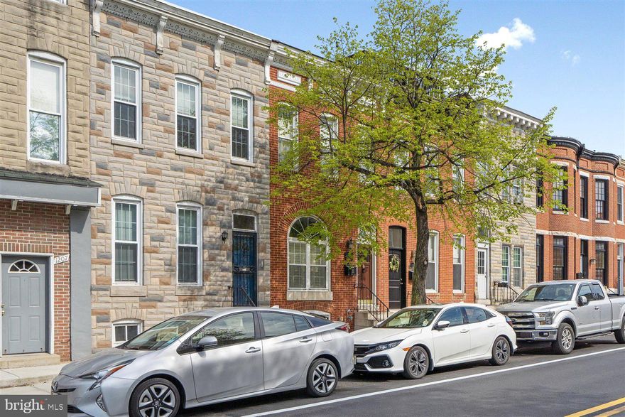 Fantastic 3 bedroom, 2 .5 bathroom home with parking for THREE cars!!  This charming Federal Hill rowhouse has so much to offer!  The main level has hardwood flooring throughout, a spacious living room that flows into a gourmet kitchen and a charming office with faux fireplace that could be used as a 4th bedroom!  The upstairs is fully carpeted and the owner's bedroom has an ensuite bath.  Other wonderful features include exposed brick, a deck off of the second level, stainless appliances and a first floor laundry room / half bath.  Great location close to shopping, entertainment, restaurants and more!