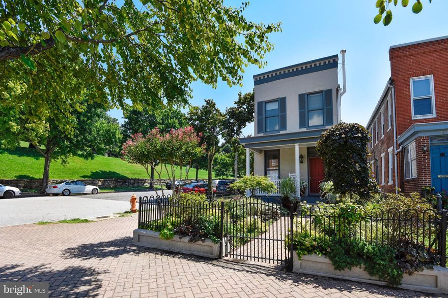 PRIME LOCATION. This end unit is directly adjacent to Federal Hill Park. Lavishly landscaped front yard, Inner Harbor and park views make this detached corner house truly one of a kind.  Large back room on first floor could be an office, gym, workshop or a first floor MSTR. Charm throughout with front porch, exposed brick, original floors and skylights. All 3 baths updated.