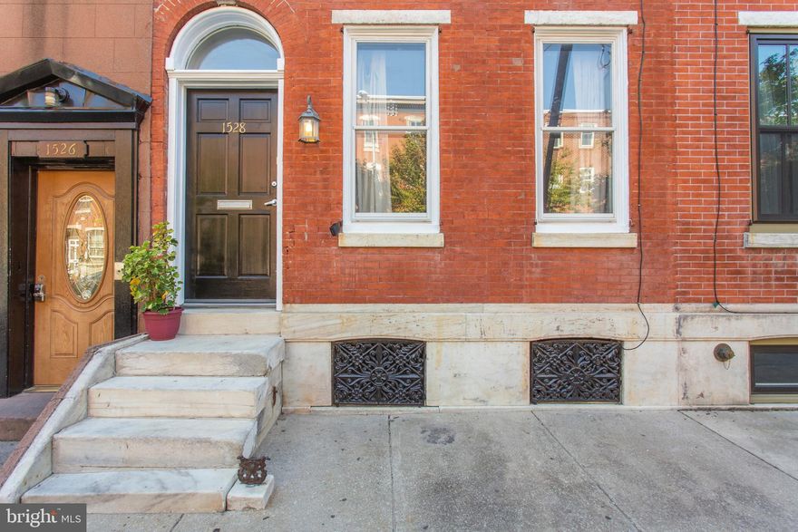 Welcome to 1528 Christian Street - A Classic Center City Philadelphia Townhome located along the Avenue of the Arts / Broad Street corridor!  This SUPERSIZED (2,350 sq ft), 3 bedroom, 2.5 bath home enjoys modern updating throughout, AND maintains many original details.  Step up the original marble stairway and enter to discover a cheerful and sunny open-floor-plan first level - featuring front living area, and a convenient powder room.  The sunny and central OPEN kitchen features unique poured concrete counters,  a "bay" of windows,  an abundance of cabinetry, updated appliances and will certainly please your chef!  Continue on to a LARGE open dining / entertaining / office / living area then further to a rear "mudroom" area - perfect for a small workout room / bike storage - you name it.  Step out back to your Urban Oasis - a rear brick patio with room for plantings and exercising that "green thumb" of yours.  Upstairs on the 2nd level find front and rear bedrooms, a space for upper level laundry, a LARGE central bathroom which features a glass-enclosed shower stall and a separate bath area with a very classic claw-foot tub.  The rear bedroom is a notably unique room featuring a built-in seating space set in a bay of windows - a lovely original detail! The top level is the icing on the cake - A HUGE owner's suite which features a front space, with new skylight, perfect for reading / relaxing and prepping for your day - AND a rear bedroom area. The central bathroom offers full tub, classic basin sink, marble tile flooring and sleek subway tile walls.  The basement is HUGE and offers plenty of space for storage, your workshop, and access to the utilities. This home also offers Central Air and Heat, Hardwood Flooring throughout, Fresh Paint - and so much more.  Just moments away from ALL of Center City - this home is your stepping stone to the abundance of Culture and Conveniences Center City Philadelphia has to offer. Do NOT miss this opportunity - please schedule your real life visit today.