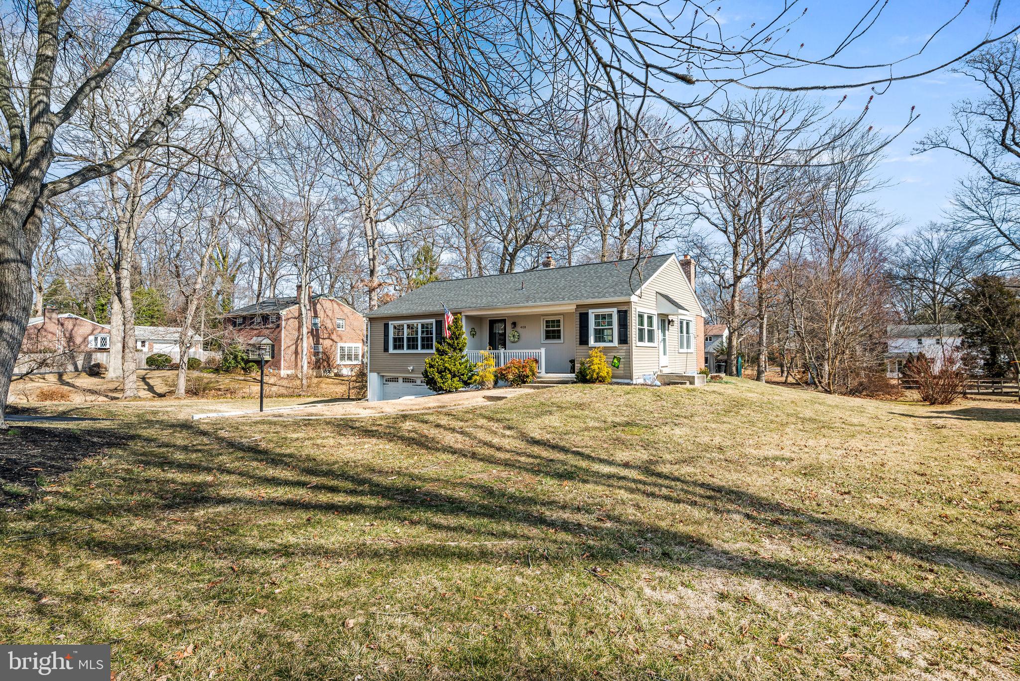This gorgeous raised rancher in desirable Scot Glen has been meticulously maintained by the current loving owners. With over 2,600 sq ft of living space this amazing home features so many wow factors. The cozy front porch and new front door welcomes you inside where the amazing oversized great room kitchen combination is super sized, sunny & bright and the perfect place for any gathering. A multitude of windows, gleaming hardwood floors, stone corner fireplace and custom lighting make this the perfect place to entertain. The gorgeous kitchen features a multi-level island with pendant lighting ample seating and tons of cabinets, a window filled breakfast nook and a built-in desk. The formal living room and dining area features banks of windows and a great space, the lovely hallway space and guest bathroom are all updated. There are so many places to work, live & recreate in this home it is a rare find. The upper level also boasts 4 large bedrooms, a spacious hall bathroom and ample hallways space for great flow. The primary bedroom en suite features a large private updated bathroom with walk-in corner shower, custom wood work, and oversized vanity. Three other spacious bedrooms and a beautiful full bathroom with huge vanity, dual sinks and a full tub & shower complete the space. The incredible lower level is a huge great room with luxury vinyl plank flooring, recessed lighting in a giant L shaped space that could serve a multitude of uses. There is room for a game area, a TV area, a bar area with counter seating and more. A separate in-home office is both private yet accessible and a large storage room has been plumbed for a future full bathroom. The lower level has an oversized storage room with laundry and so much storage. There is a 1 1/2 car garage. This house sits on almost a half of acre lot on an incredibly desirable street. The home also features a whole house generator hook-up & the current owners had the gas lines run to the property, so a new owner has the option of converting to gas. A rare commodity in this neighborhood. Added bonuses: newer roof with dimensional shingles & all new decking (2018), new on demand hot water (2024), newer Central Air (2022), windows and vinyl siding (2018), wood burning fireplace new flu & new concrete work at the chimney, paver patio, custom exterior landscaping and more.