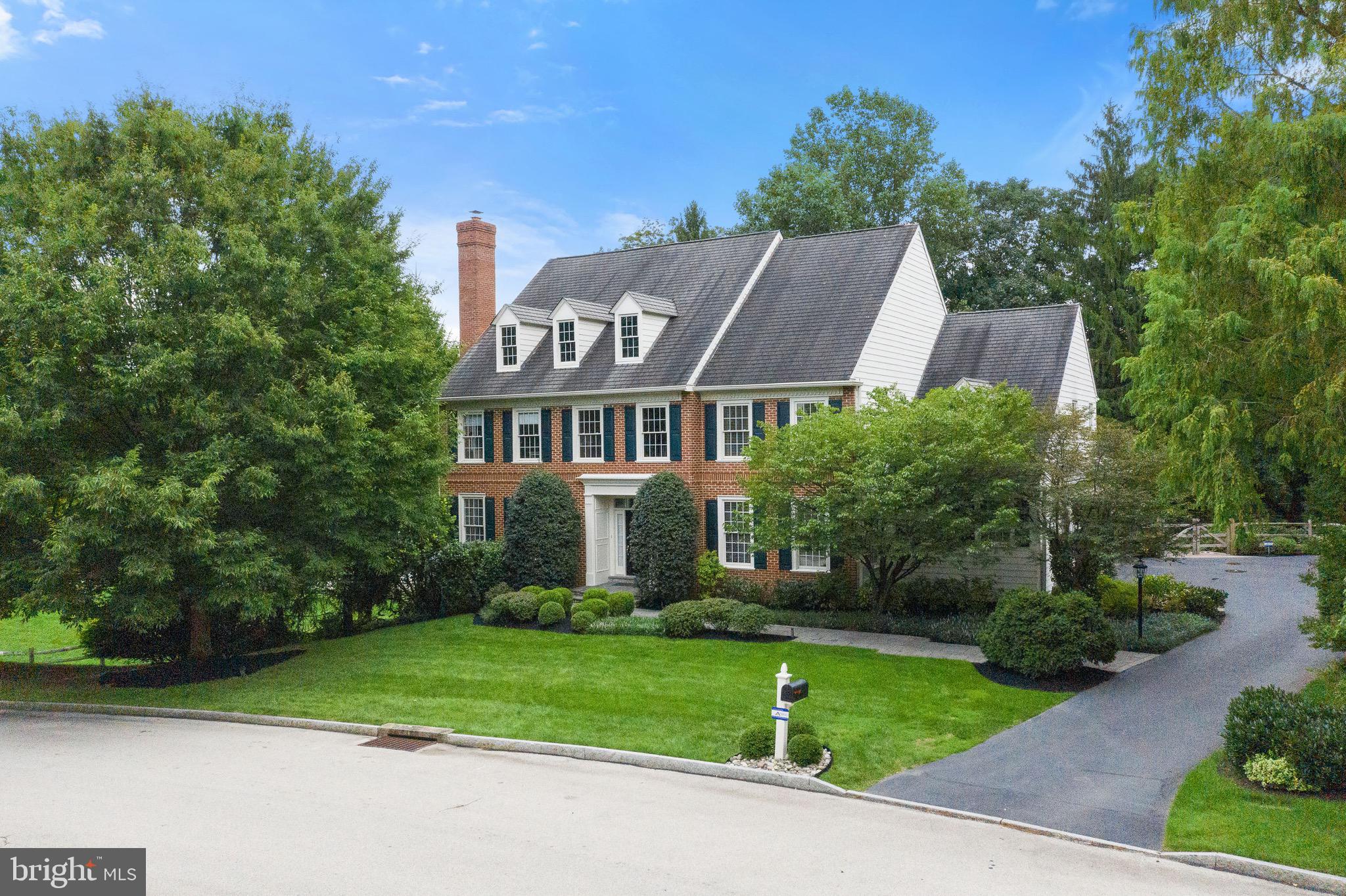 Located in the center of Philadelphia's coveted Main Line, 301 Durham Drive offers the very best of Town and Country living! Edenton Place is a quiet enclave of only 18 homes, with a Villanova address in the center of Radnor Township, which offers award winning Radnor schools (Radnor Elementary), and ultimate convenience. This Vaughn-built brick and Hardie siding home, combined with this sensational location, are a perfect combo for easy living. Inside, the floorplan welcomes you with a large entry foyer and dramatic turned staircase. To the left, you will find the formal living room with fireplace, and to the right the dining room. The front hall features two coat closets for plenty of storage. As you walk to the back of the house, a formal powder room and large home office/den/study with bench window seating makes the perfect work from home space. The back of the home offers full open concept living, with an updated Chef's kitchen with cabinets to ceiling, Thermador double oven, Wolf cooktop, Sub Zero paneled refrigerator, wine fridge, large center island with plenty of seating, and breakfast area. Just off of the kitchen is one of the best parts of this home - the large and open covered screened in porch over azek decking. This porch acts as an extension of the living area and allows for 3 season enjoyment: because it is covered, it's always clean and ready for enjoyment. The porch provides access to the outdoor deck, great for sunning and bbq. Back inside, adjacent to the kitchen area is the great room with a cathedral ceiling, wall of windows with plantation shutters, stone hearth to the gas fireplace, and built in surround sound system. This room is the perfect spot to watch the game or to get cozy for a movie. To complete the main level, adjacent to the kitchen, a butler's pantry for easy entertaining connects the kitchen to the dining room. The mudroom features lots of closet storage, a large laundry room, entry to the three car garage with lots of wall and ceiling storage, and back stairs to the 2nd floor. Three zones for heating and cooling and Nest Thermostats make this home energy efficient and easy to control even from a remote location. Upstairs you will find the private and expansive Main Bedroom suite with tray ceiling, two custom walk-in closets, and a sitting room with Hunter Douglas window treatments, which is large enough for a 2nd home office or upstairs family room. The skylit Main ensuite bath features two separate floating vanities, a very current freestanding tub, and an oversized walk-in shower that will make you feel like you are at a spa. Three additional generous bedrooms are on this level, one with ensuite bath and the other with a shared bath with double vanity and shower. The attic walk-in storage area is off of the 4th bedroom. The finished walkout lower level features a large home gym with gym flooring and wall of mirrors, family room, play area, and golf driving range, as well as a built in wine storage, workbench and lots of cabinet storage. The walk out slider leads to the finished paver patio to a private fenced yard. Additional hardscaping connects the rear of the house to the driveway. Nearby, Rte. 476 offers connections to the 76 Expressway for easy access to Center City, the Airport and New York City. Walk to the Villanova train station, and to Villanova University, across the street are the Agnes Irwin turf fields, walk to the Rosemont playground, 2.5 miles to downtown Wayne, nearby World class shopping at King of Prussia Mall, or 4 miles away at Ardmore's suburban square. Wayne or Ardmore farmer's markets, antique and specialty stores. A rare opportunity in an unparalleled location.