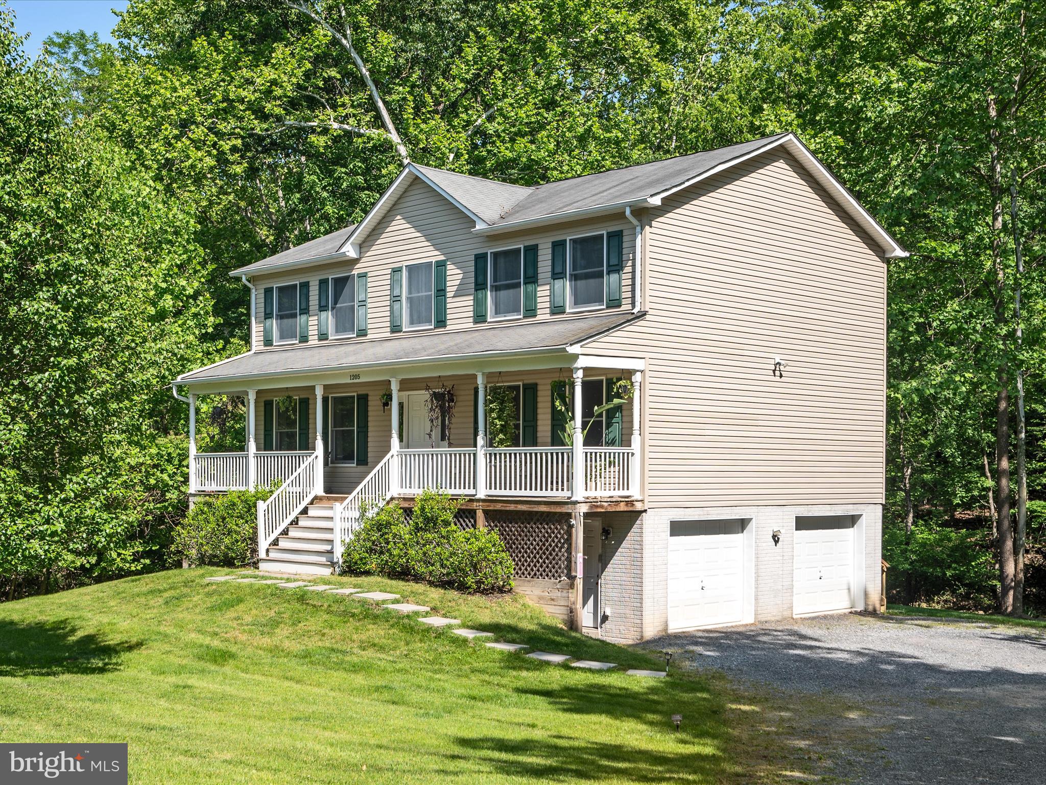 ***OPEN HOUSE THIS SUNDAY, JUNE 8th, FROM 11-1PM!!!!***
Welcome to Lake Living in Paradise! Quite possibly the most private and serene setting in all of Lake Holiday—this beautiful colonial sits on nearly a ½-acre wooded lot with a babbling creek and common area on three sides, offering rare privacy and peace. Step onto the inviting large front porch or relax out back on the brand new Trex deck (2025) with a woodsy landscaped level yard—perfect for gatherings. There's also a huge, level parking area ready for guests and lake toys alike. Inside, you'll find 4 spacious bedrooms upstairs with newer carpet and a large primary suite featuring a walk-in closet and private bath. The main level boasts hardwood floors in the dining room, a generously sized eat-in kitchen with space for 5 bar stools plus a table, double pantries, and newer appliances—including a dishwasher (2024). The oversized living room boasts newer LVP flooring and offers endless flexibility for entertaining or lounging. The walkout basement is bright and improved—ready to be transformed into additional living space. The garage is oversized with built in cabinetry making for a great workshop and extra room for your boat! A newer water heater, washer and dryer (2022) and new gutter guards and downspouts round out the updates. Whole-house insulation (2022) and new exterior doors (2023) add to energy efficiency and comfort. All of this is located in a 240-acre gated lake community loaded with amenities: boating, swimming, fishing, sandy beaches, playgrounds, dog parks, community clubhouse with fitness room, basketball, volleyball & tennis courts, fishing pier, and scenic trails. Xfinity internet available. This is Lake Holiday living at its best—private, peaceful, and packed with amenities. Schedule your tour today and make your dream of lake life a reality!