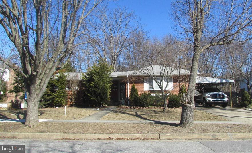 Larger than it appears and with kitchen upgrades. Possible 4th bedroom in basement. Don't need another bedroom, then use room as a play room, den or office. Hardwood floors under wall to wall carpet. Large family room addition on main level of house and another large family room in basement with a fireplace. New carpet in dining room. Off street parking sufficient for multiple cars or an RV.