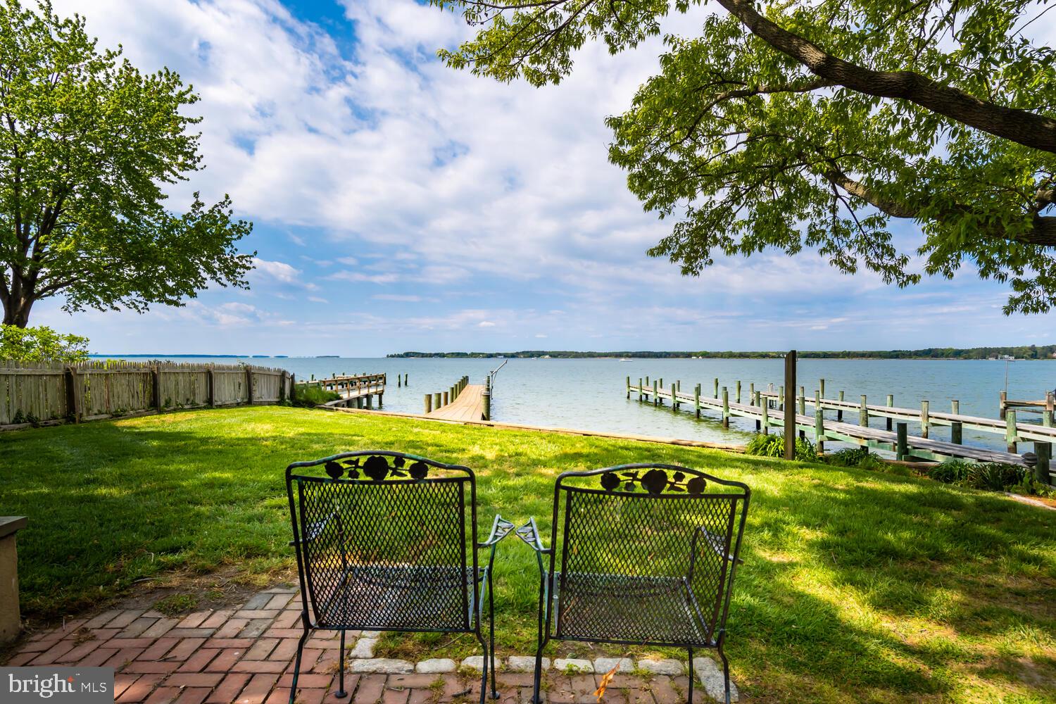 Historic District of Oxford 4 bedroom waterfront home with Sunset Views! New 126', 6' wide dock on the Tred Avon River, yard with patio, and plans for a pool. The house has been designed for entertaining with a large gathering room on the first floor with large woodburning fireplace. Glass enclosed porch on waterside provides a wonderful view of the water! First floor primary bedroom has a full bath. Of the 3 second floor bedrooms, one is large enough for a 'dorm room'. Large bright kitchen with room for table and chairs as well as a formal dining room. Property located at end of Sullivans Alley. Please try not to block anyone in the Lane-plenty of room in the driveway or on Benoni Street to park! Thank you so much