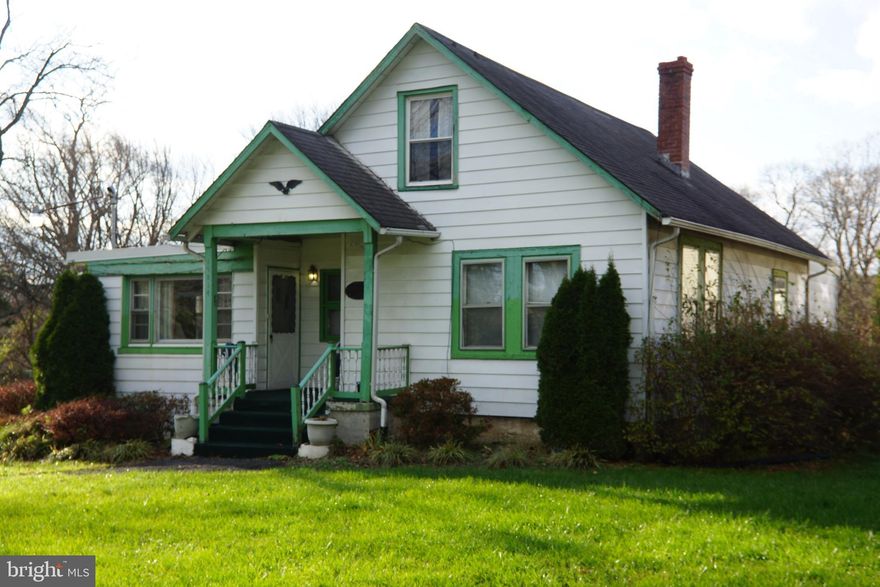 INVESTOR ALERT! Don't miss the amazing opportunity to fix up this home on a large lot in an excellent location.  This home comes with 2 additional parcels that make up a total of .92 acres! Public water access is available to switch over from existing well at the buyers expense.  This home offers a covered front porch, hardwood floors throughout, 4 bedrooms & 1 full bath on the main level.  A breezeway through the back from the kitchen exits to a deck overlooking the huge backyard and to a large laundry area.  Nice size Kitchen with table space.  The Attic is a full walk-up floored attic with plenty of space to make into extra living space or offering plenty of storage.  The basement used to be one of the hottest barber shops in town! Access is through the outside but there is a toilet and still sinks hooked up below.  There is a nice size front yard that sits back off the road and a huge side and backyard, Plenty of room for parking.  Located just a few homes away fro Stewartown Park, Across the street from the public bus stop, less than half a mile to Grocery stores, restaurants and gas stations, Shady Grove Metro is only 6 miles away. What better location on this size lot can you get at this price?!  There is a ton of potential with this one, don't miss out!  This Home Needs work and is being sold AS IS ONLY! Cash, Conventional or Hard Money ONLY!**Accepting Back-up Offers**