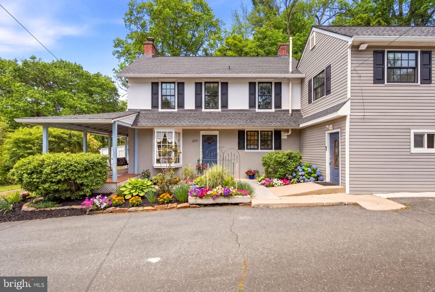 Residentially Zoned with Approved Business Variance – A Rare Live/Work Opportunity. Prominently positioned along Baltimore Pike, this exceptional estate offers the unique advantage of an approved business variance with exterior signage permitted, providing outstanding visibility and exposure. The thoughtfully designed layout features a  SEPARATE PRIVATE WING ideal for a law office, title company, CPA firm, consulting practice, art studio, wellness business, or other professional use, while maintaining COMPLETE PRIVACY AND SEPARATION from the main residence. Alternatively, the space may be converted into a  TWO CAR GARAGE, offering flexibility to suit a variety of lifestyle or business needs.
Set on 2.83 acres of picturesque Pennsylvania countryside, this gracious, light-filled 5-bedroom, 2 full and 2 half-bath STUCCO-OVER STONE ESTATE seamlessly blends timeless 17th-century character with modern functionality. The home offers exceptional curb appeal, defined by its classic stone architecture, preserved period details, and commanding presence. A beautifully private rear patio extends the living experience outdoors, creating a serene setting for relaxation or elegant entertaining.
Inside, beautifully maintained hardwood floors, vaulted ceilings, custom built-ins, refined millwork, and abundant natural light showcase the home's craftsmanship and character. The renovated chef’s kitchen features a gas stove, expansive center island, spacious pantry, fireplace, and striking original fieldstone accent wall, with direct access to the rear patio for seamless indoor-outdoor living.
The second level includes a SPACIOUS PRIMARY SUITE with an updated spa-inspired bath featuring a soaking tub and walk-in shower, along with additional bedrooms and updated baths. A large flexible bonus area offers possibilities as an in-law suite, playroom, office, or lounge space.
Recent improvements include a new roof (2020), updated windows and skylights, electrical upgrades, basement waterproofing (2023), and a new zoned hydronic heating system. Located in the highly regarded Rose Tree Media School District and conveniently close to major routes, shopping, dining, and regional amenities, this distinctive property presents a rare opportunity to enjoy luxury residential living while operating a business from home with unmatched visibility and flexibility.