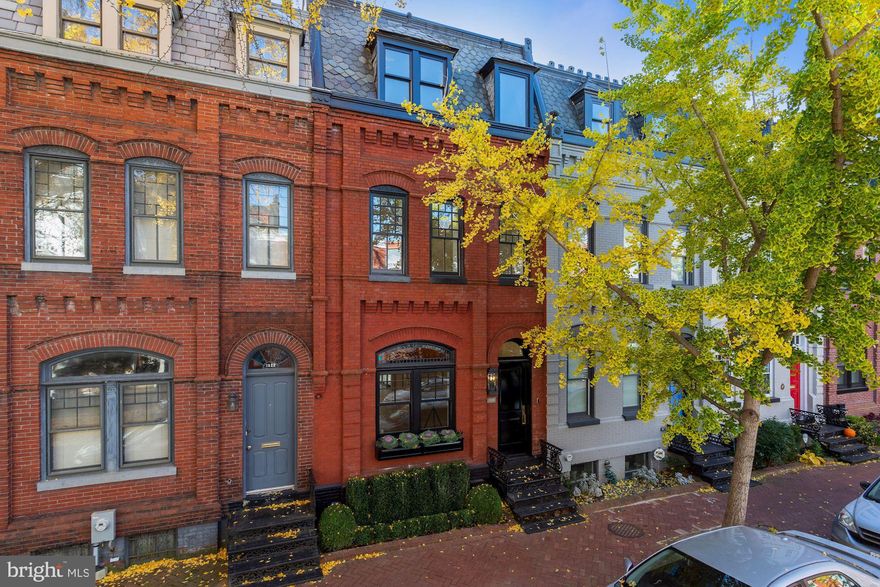 Sold in Washington Fine Properties' Private Placement Program.  Akseizer Residential, one of Washington DC's preeminent luxury builders, has created another design masterpiece with a top to bottom reconstruction of this circa 1885 brick townhouse on one of the most special and picturesque blocks in the city. Spectacular finish level throughout approximately 3000 SF interior with gorgeous white kitchen with Pietra black marble counters and waterfalls, extensive custom built-ins everywhere, custom herringbone floors, Baldwin hardware, white marble and Waterworks bath, and three outdoor roof terraces overlooking stunning Southern views of the city skyline and the Scottish Rite Temple. 5 bedrooms, 3.5 bathrooms. Gated Parking.