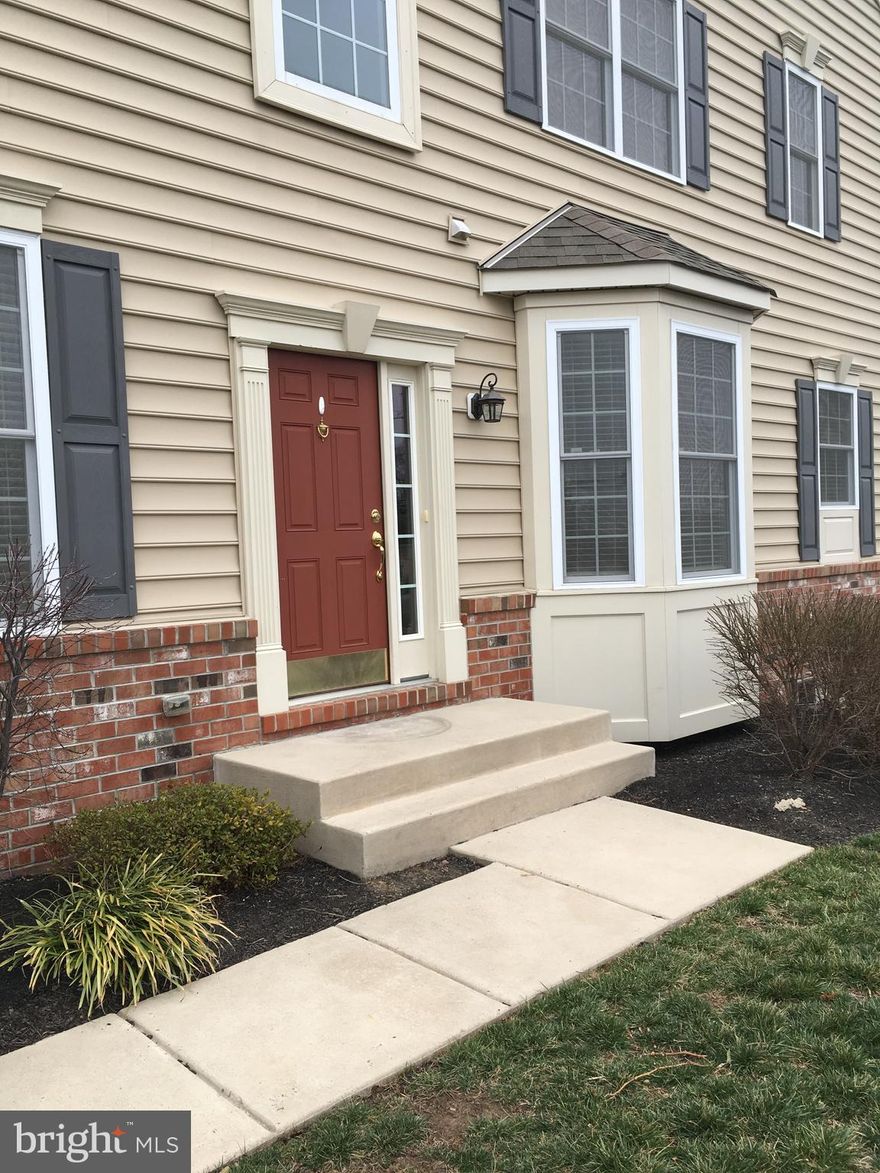Spacious end unit townhome with 1,995 square feet of living space. One car garage with automatic opener. Family room with gas fireplace. Hardwood flooring in the kitchen and family room. Primary suite includes walk-in closet, sitting room and ensuite bath with double bowl vanity and stall shower.  Two additional spacious bedrooms, hall and second floor laundry.