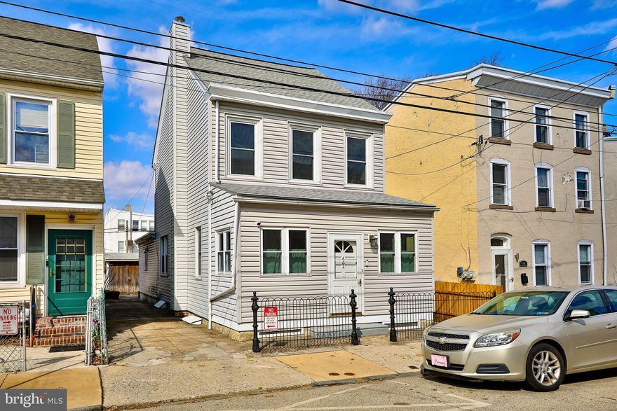 Charming Old-world Detached Home with Off-Street Parking in Roxborough.  Step into this beautifully maintained pre-1895 single home, where historic charm meets modern convenience. Featuring original hardwood floors, exquisite woodwork, and abundant natural light, this home offers a warm and inviting atmosphere.  The enclosed front porch, surrounded by large windows, provides a perfect space for relaxing with a book or shedding wet gear on rainy days. Enter through the original front door into a spacious living room, where a classic wood banister leads to the upper floors. The formal dining room, with windows on both sides, creates a bright and airy setting for gatherings. The eat-in kitchen maintains its cozy charm, while the adjacent laundry/mudroom offers additional convenience with a second toilet and access to the private patio.  Upstairs, you'll find two generously sized bedrooms, a bonus room—ideal as a home office or nursery—and a new hallway bath with ceramic tilework. The third floor features a spacious loft-style bedroom, once used as a private teen retreat.  Outside, the private driveway accommodates two cars, leading to a rear yard with a versatile shed/outbuilding, perfect for a workshop, studio, or additional storage. The secluded patio nestled between the house and shed provides a great outdoor space to unwind.  Additionally there is a new boiler, newer hot water heater, whole house water filter, new stack, and a new electric panel.  The shed roof was replace 2020, rear roofs in 2023. Located just half a block from Roxborough’s vibrant shopping and dining scene, you'll enjoy easy access to New Ridge Brewery, White Yak, Ban Bamboo, and more. This prime location is also close to Main Street Manayunk, Wissahickon Park, public transit, and major roadways, making commutes to Center City, Chestnut Hill, and beyond a breeze.  Don’t miss this rare opportunity to own a piece of Roxborough’s history! Schedule your showing today.