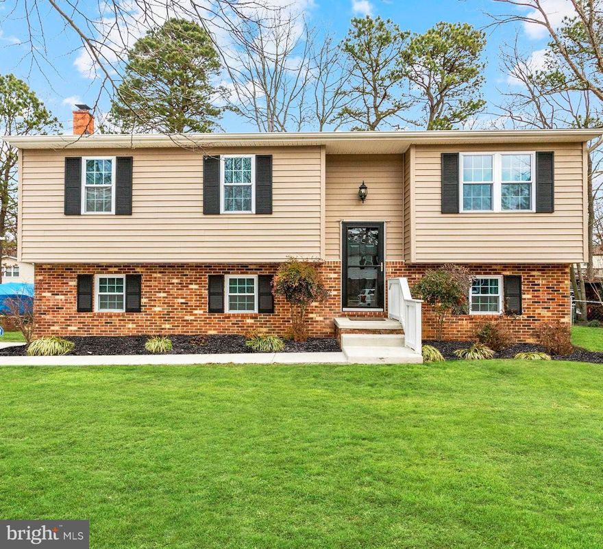 Beautiful 4 bedroom, 3 full bath home in water access Boulevard Park!  So many features and upgrades, nothing for you to do but move in!  Updated open kitchen with center island and custom cabinetry, plenty of cabinet space!  Dining room with gorgeous built-in buffet cabinet.   Completely remodeled master suite with stunning ceramic tile spa like bath and walk in closet with built in shelving!  Hardwood flooring, fresh paint, crown mouldings, chair railing, brand new hall bath, 2nd bedroom also has an ensuite bath!  In addition to being amazing on the inside the roof, siding , windows and hot water heater are all NEW within the past 5 years and the driveway and sidewalks have just been repaved!  Fenced yard is landscaped with perennials that bloom all seasons and includes a maintenance free composite deck, patio, and storage shed.  Community amenities include a boat ramp, pier, waterfront playground and a clubhouse.  Bodkin, CHS schools, 1 year home warranty included.  This is a MUST-SEE, HURRY!!