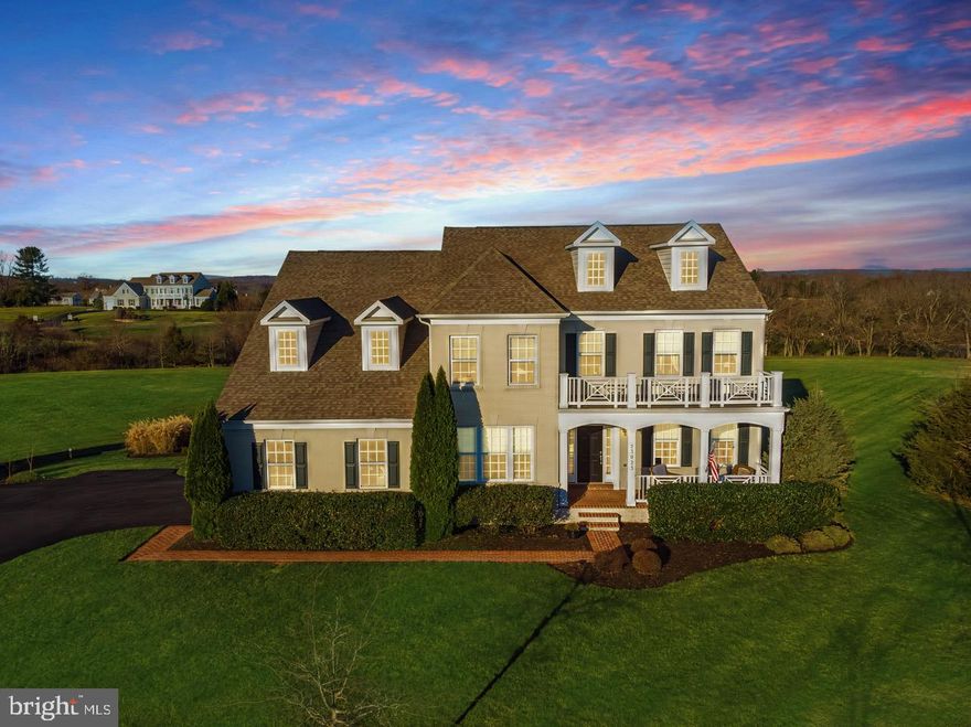 Set on a sprawling 4-acre lot in the private, prestigious Huntleigh at Creighton Farms neighborhood, this stunningly updated “Sutton” model offers 5 bedrooms and 4.5 bathrooms, encompassing over 4,900 square feet of meticulously designed living space across three finished levels. The elegant white brick exterior with a welcoming covered front porch exudes timeless curb appeal, while the professionally landscaped grounds provide a serene backdrop for this exceptional residence. The side-load, oversized 2-car garage offers ample parking and storage, with plenty of room for a future secondary garage.
 
Upon entering, you are welcomed by a grand oak staircase, fresh custom paint, and brand-new wide plank floors that flow throughout the first floor. The formal dining room and living room are adorned with large windows that bathe the space in natural light, showcasing picturesque views of the lush greenery and setting the stage for elegant gatherings.
 
At the heart of the home, the updated gourmet kitchen is a culinary dream, featuring gleaming white quartz countertops, pristine white cabinetry, and chic gray subway tile backsplash. Newer stainless steel appliances, a spacious expanded center island with ample storage, and a convenient coffee bar make this kitchen ideal for both entertaining and everyday functionality. A walk-in pantry offers plenty of storage, and there’s a designated space ready to be customized as a drop zone.
 
Step through the sliding glass doors to the Trex deck and get ready to design your perfect patio – extending the outdoor living space to allow even more room to entertain or unwind.
 
The inviting family room is anchored by a floor-to-ceiling stone gas fireplace and accented by a coffered ceiling, creating a warm and welcoming atmosphere. A private home office on the main level offers the perfect blend of style and practicality.
 
Upstairs, the primary suite is a true sanctuary, featuring a generous sitting area, and a massive walk-in closet. The primary bathroom is a show-stopper, showcasing spa-inspired luxury with a quartz-topped vanity, a modern stand-alone soaking tub, and a glass-framed walk-in shower complete with a niche and built-in bench – a serene escape for ultimate relaxation.
 
The upper level also includes three additional bedrooms – two sharing a Jack-and-Jill bathroom and the third with its own en-suite bath – all featuring walk-in closets and new plush carpeting. A spacious walk-in laundry room completes the upper level.
 
The lower level is nearing completion. Once finished, it will include a spacious recreation room with wide plank flooring, a fifth bedroom, and a fourth full bathroom – creating the perfect space for relaxation and entertainment.
 
Outside, the expansive backyard offers endless possibilities – from creating a resort-style pool to adding an outdoor kitchen, making it ideal for outdoor entertaining and recreation.
 
This property is located in the highly sought-after Lightridge High School pyramid, part of one of Loudoun County’s top-rated school districts, and within fifteen minutes of Paul IV Catholic High School and Loudoun County Day School – an added bonus for families seeking exceptional educational opportunities.
 
Conveniently located across the street from Creighton Farms Golf Club, this home offers a Leesburg address while being perfectly positioned between Ashburn and Aldie and tucked beside Willowsford. This prime location provides easy access to top schools, shopping, dining, commuter routes, and 20 minutes to Dulles International Airport making it an ideal choice for those seeking both tranquility and convenience.