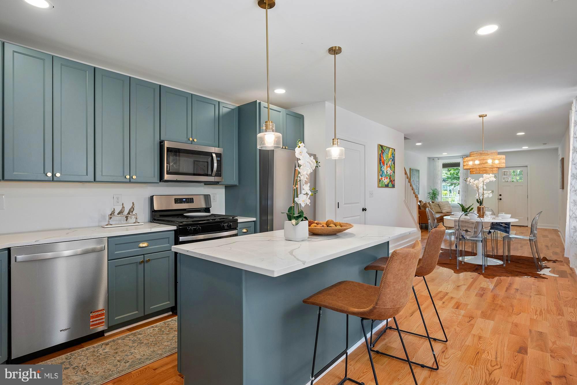 Nestled on sought-after Roland Avenue in the heart of Hampden, this fully renovated semi-detached home offers an exceptional blend of charm, luxury, and rare outdoor space. Set on an unusually deep 150-foot lot—a true rarity in the area—this property provides ample room for outdoor entertaining, gardening, or expansion.
The open-concept main level is filled with natural light and features wide-plank solid white oak floors throughout, creating a warm and sophisticated backdrop. The inviting living room flows seamlessly into the dining area and thoughtfully designed kitchen, which features green slate cabinetry, crisp quartz countertops, a spacious eat-in island, and sleek stainless steel appliances. A convenient walk-out from the kitchen leads to the expansive backyard—perfect for enjoying outdoor living.
Upstairs, the second level offers a sunlit guest bedroom with generous closet space and a hallway bathroom finished with stunning green Spanish tile (imported from Spain) and natural Italian marble hexagon floors. The owner’s suite provides a peaceful retreat, complete with an en-suite bath featuring timeless white subway tile, a walk-in shower, and a striking mosaic tile floor crafted from exotic Calacatta and black marble.
The third-floor loft is a charming bonus space, ideal for a home office, cozy reading nook, or creative studio.
Located in the heart of Hampden, you’re just steps away from The Avenue on 36th Street—home to an eclectic mix of locally loved restaurants, shops, cafes, and art galleries. Explore neighborhood favorites like The Food Market, Golden West Cafe, and Dylan’s Oyster Cellar, or enjoy nearby green spaces including Wyman Park and the Jones Falls Trail. The Rotunda, the Baltimore Museum of Art, and Johns Hopkins University are just minutes away, with easy access to I-83 for a quick commute.
Recent updates include all-new energy-efficient windows, a new HVAC system, and a new roof—offering modern comfort and long-term peace of mind.
