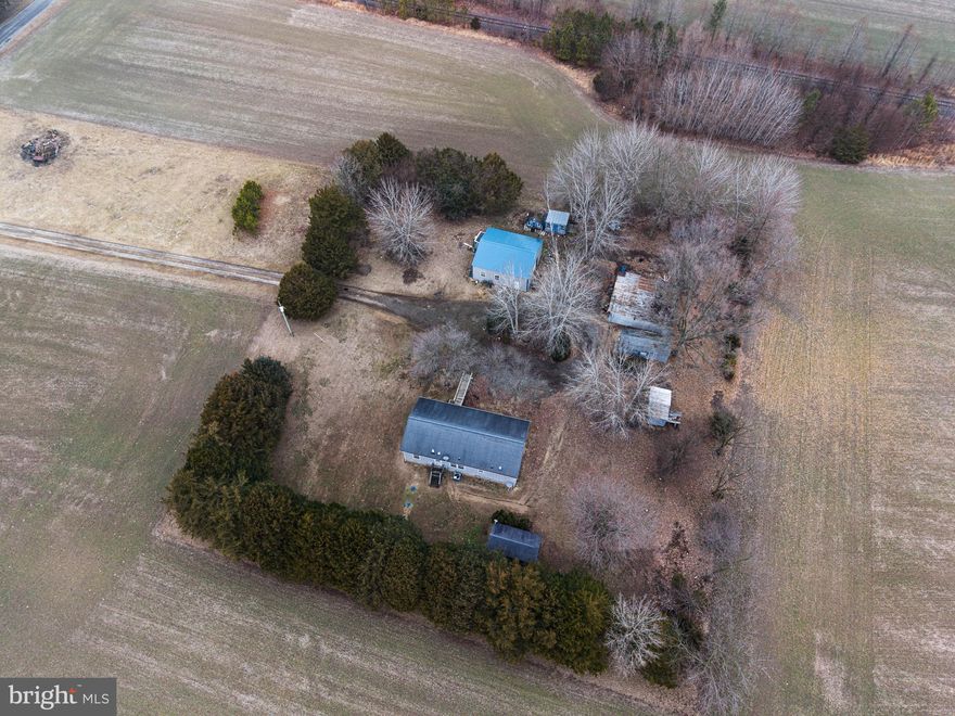 Charming 3-bedroom, 2-bath rancher set on a private 1.43+/- acre lot in a peaceful country setting.  The property features a large pole barn with overhead door, plus multiple additional sheds and outbuildings. An excellent  opportunity with endless potential.
