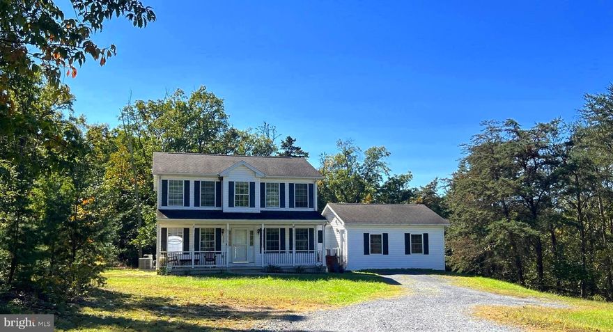 Escape to the tranquility of country living on this beautiful 2-acre property!  This spacious home boasts an open floor plan with 4 bedrooms and 2.5 baths.  Enjoy the versatility of an extra-large room, perfect for an in-law suite, guest room, or playroom.  The main level features a welcoming living room, formal dining room, cozy family room, well appointed kitchen and convenient laundry room.  With a large unfinished basement there is plenty of potential for customization.  Experience the perfect blend of comfort and potential in this charming country home!