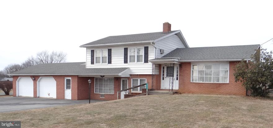 Upcoming Auction on April 18 at 10:30 am.
This spacious split-level home consists of 3BR, 1BA, and vanity space (upper level), Kitchen, Dining Room, Living Room (mid-level), and Den w/ fireplace, Utility Hallway, Laundry w/ Bath, and 2-Car Garage (ground level). In addition, the rear of the home boasts a Screened-in Porch and additional Sunroom (ground level), and Open Concrete Patio (mid-level). Heat is Electric Baseboard and AC requires window units. Onsite Well and Public Sewer connections. This property will require some updating, but is a wonderful home in a great convenient location in Greencastle! Hardwood floors throughout!
Boundary marker details, deed, and plot plan are available in the office of Franklin County Register & Recorder. Terms: $7,500 down on sale day