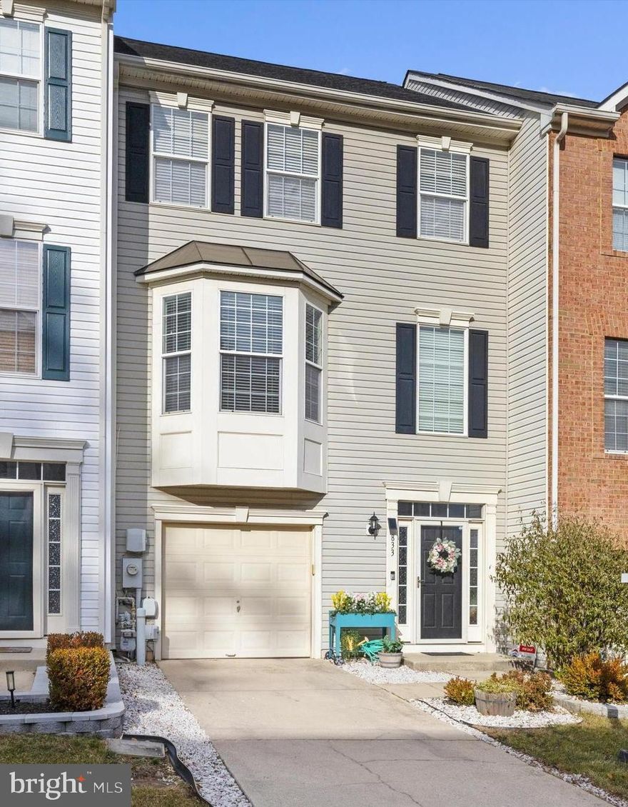 **VA Assumable Loan 2.875% **  This beautiful townhome is calling your name in the highly sought after neighborhood of Piney Orchard. This is one of the larger homes in the Stone Crossing community with multiple bump-outs, including a large bay window in front. Upon entry you will find a tiled entrance, garage access, a large family room and a bonus back room that can be used as an office, gym, or bedroom! The first floor also features a half-bath and a laundry closet with custom storage added. Upstairs, you find yourself in an open concept kitchen with dining space, a pantry, and granite countertops with a spacious island.  Off the kitchen you will find a great bump out room and spacious deck for enjoying a morning cup of coffee or entertaining the family and guests while grilling. Open living room allows you to be part of all the activity in the kitchen. Moving to the third floor, the primary bedroom has vaulted ceilings and a bright ensuite bathroom, including a soaking tub, shower, and double vanity. The two remaining bedrooms are well lit and have overhead lighting and fans. This property also has a lower-level patio and fully fenced yard. You will feel right at home here! Roof- 2022, Water heater 2025, lighting fixtures and fans updated throughout, stainless appliances and updated cabinets. Walking distance to playground and visitor parking. TONS of neighborhood amenities including indoor and outdoor pools, playgrounds, sports fields, walking/hiking trails, and so much more! Close to Fort Meade/NSA, MARC station, shops, and major highways.  Welcome home!