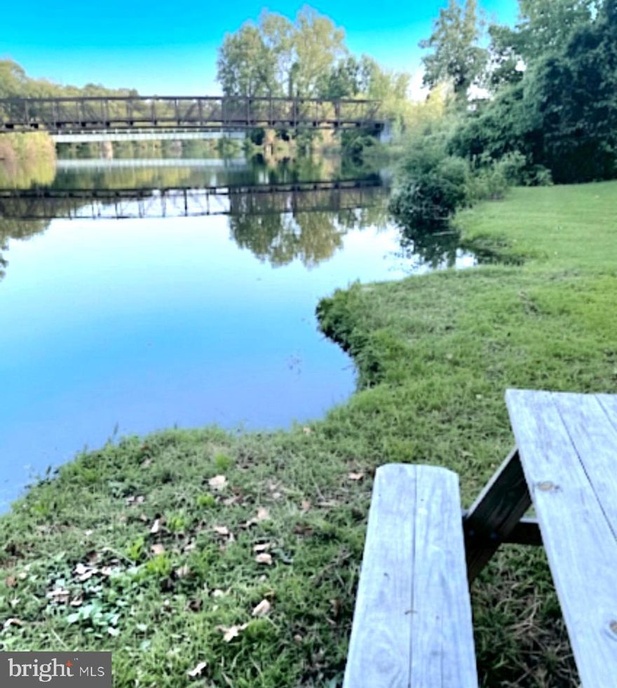 Bring Your Fishing Boat! Nestled along the tranquil waters of Marshyhope Creek, this waterfront retreat offers peaceful views and the rare opportunity to fish or kayak directly from your own private shoreline. This charming 2,820 sq. ft. Victorian home features 4 spacious, freshly painted bedrooms and 1.5 baths and is ready for you to add your special touches. Begin your mornings with coffee on the inviting front porch or host memorable gatherings with family and friends in the generous outdoor living space. Inside, the thoughtfully designed layout offers expansive rooms ideal for everyday living and entertaining. Enjoy cozy evenings by the gas fireplace in the living room, relax in the separate family room, or find inspiration in the sun-filled sunroom, perfect for a home office or reading nook. Additional highlights include a dedicated office and flexible living areas that easily adapt to your lifestyle. Ideally located just minutes from a public boat ramp, walking trails, pavilion, playground, and basketball courts, this home is great for nature lovers and those with active lifestyles.