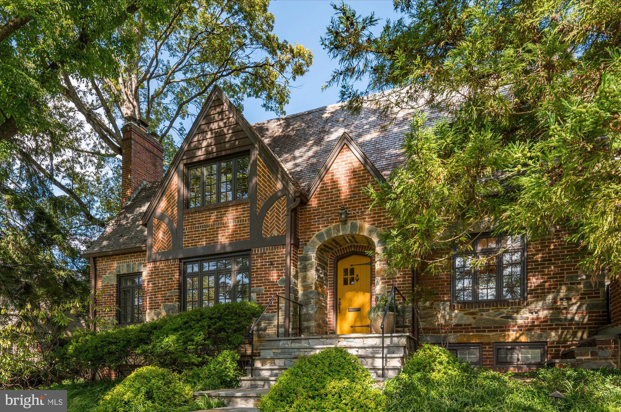 Nestled within the prestigious enclave of Country Club Hills, where timeless elegance meets modern luxury, stands a magnificent home of distinction. Welcome to 3201 N. Wakefield St, an exquisite residence built in 1935 and meticulously renovated with modern sophistication in mind. A true masterpiece, it showcases all the hallmarks of its timeless Tudor design, including decorative half-timber beams, an intricate brick and stone-patterned exterior, lattice windows, and charming arched doorways that evoke an air of timeless refinement. It stands proudly on a generous .40 acre corner lot, graced with a lush canvas of manicured lawns and mature trees, setting the stage for a truly enchanting living experience.
Step inside its gracious foyer, and you'll discover a harmonious blend of formal and casual living spaces. The formal living room with a wood-burning fireplace exudes refinement and sophistication, while the formal dining room on its opposite side is an elegant canvas for memorable gatherings.
Adorned with soapstone counters, dual sinks (including a prep sink), and Viking commercial appliances, the open-concept kitchen is a chef's dream. A captivating arched window frames views of the garden, and a spacious island with built-ins invites both culinary creativity and offers ample space for meal preparation. A door from the kitchen opens to an outdoor patio where you can enjoy alfresco dining while overlooking the meticulously maintained lawn and majestic trees. This culinary haven includes an expansive space that accommodates a breakfast area and seamlessly opens to a family room adorned with a gas fireplace. The adjacent library study and all-season sunroom provide tranquil retreats, each opening to a separate outdoor patio, blurring the lines between indoor and outdoor living.
Upstairs, a beautiful sitting area graces the landing outside the primary bedroom suite. The primary bedroom is a true masterpiece, featuring French doors, a bay window with built-in seating, and an impressive half-moon accent window at ceiling height, bathing the room in natural light, and providing enchanting views of the outdoors. The primary suite also boasts a walk-in closet, a spa-like bathroom with dual vanity sinks, and a standing shower that offers views of the outside garden through a window protected by a frosted glass door. This level holds three additional bedrooms including an en-suite, and a full bathroom.
Descending to the lower level, a generously sized recreation room with a wet bar and a gas fireplace awaits, providing an ideal space for entertainment and relaxation. Additionally, you will find a half bathroom, a well-appointed laundry room, utilities and convenient access to a private 2-car garage.
3201 N. Wakefield St is more than a residence; it's a testament to the artistry of design, where timeless Tudor elegance meets contemporary luxury, resulting in a residence that is truly exceptional in every sense. Welcome to a life of unparalleled refinement and comfort in the heart of Country Club Hills!